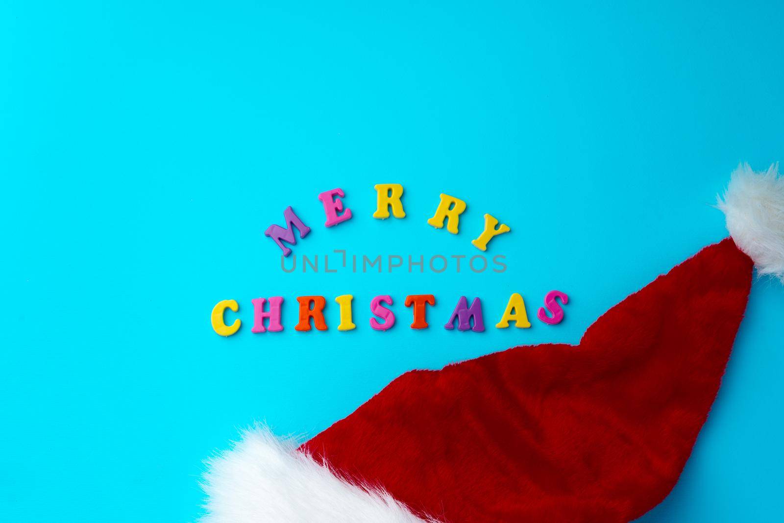 Words Merry Christmas on blue background top view, copy space