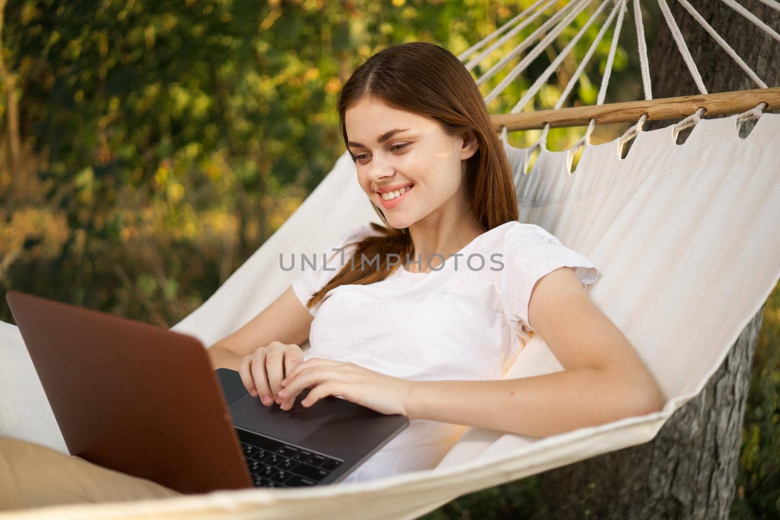 woman love with laptop on nature vacation work travel by Vichizh