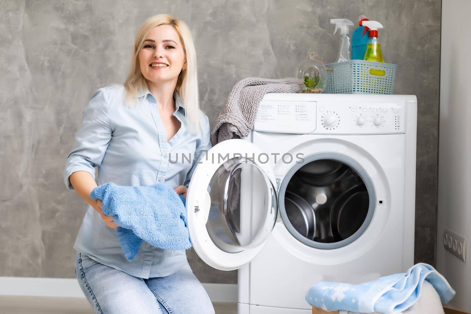 pretty smiling girl in the laundry room