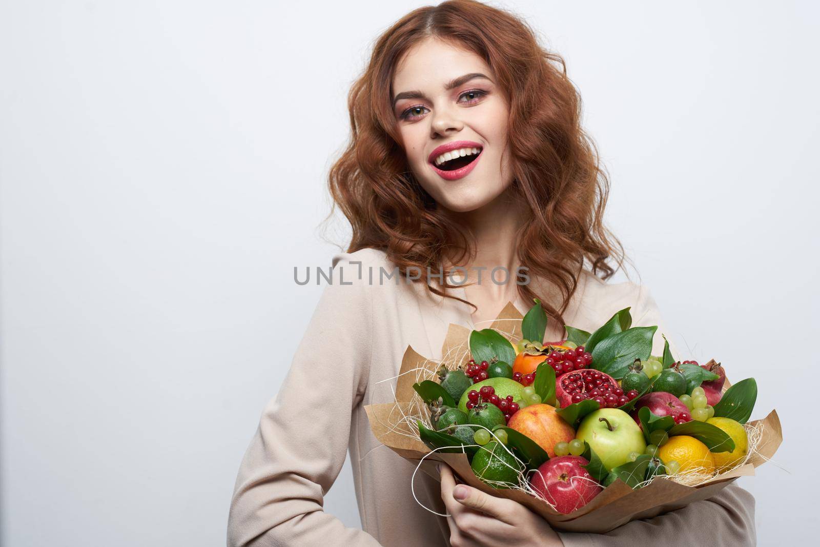 portrait of a woman fun posing fruit bouquet vitamins isolated background. High quality photo