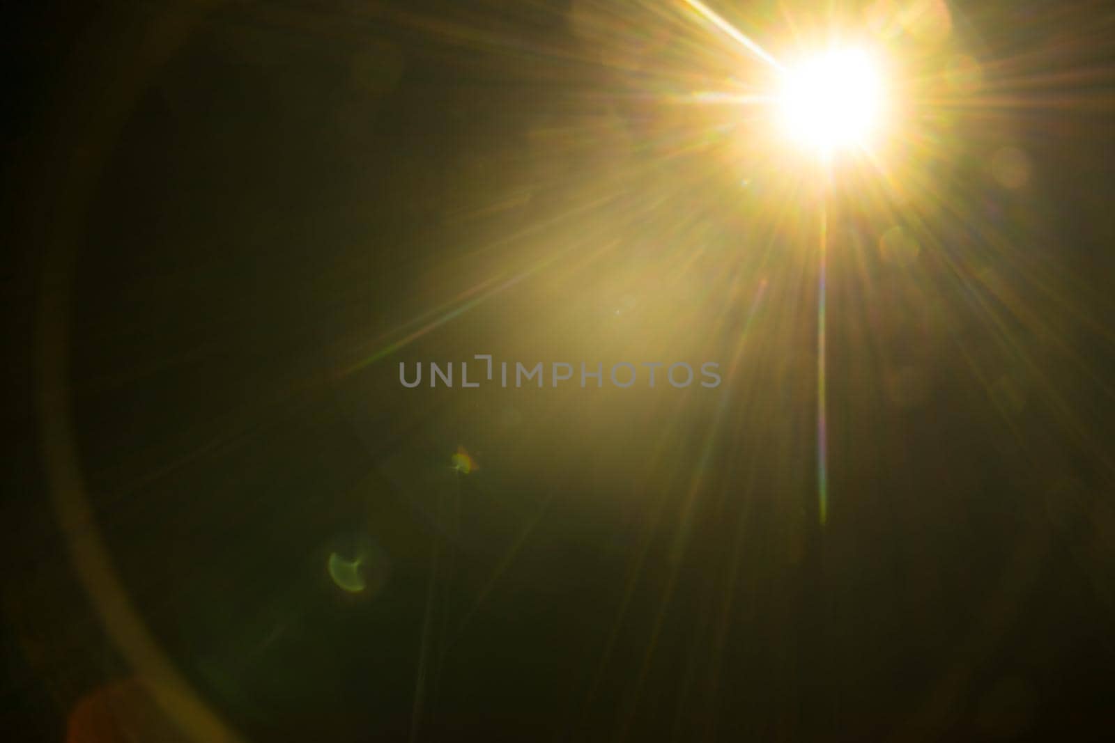 Abstract Natural Sun flare on the black.