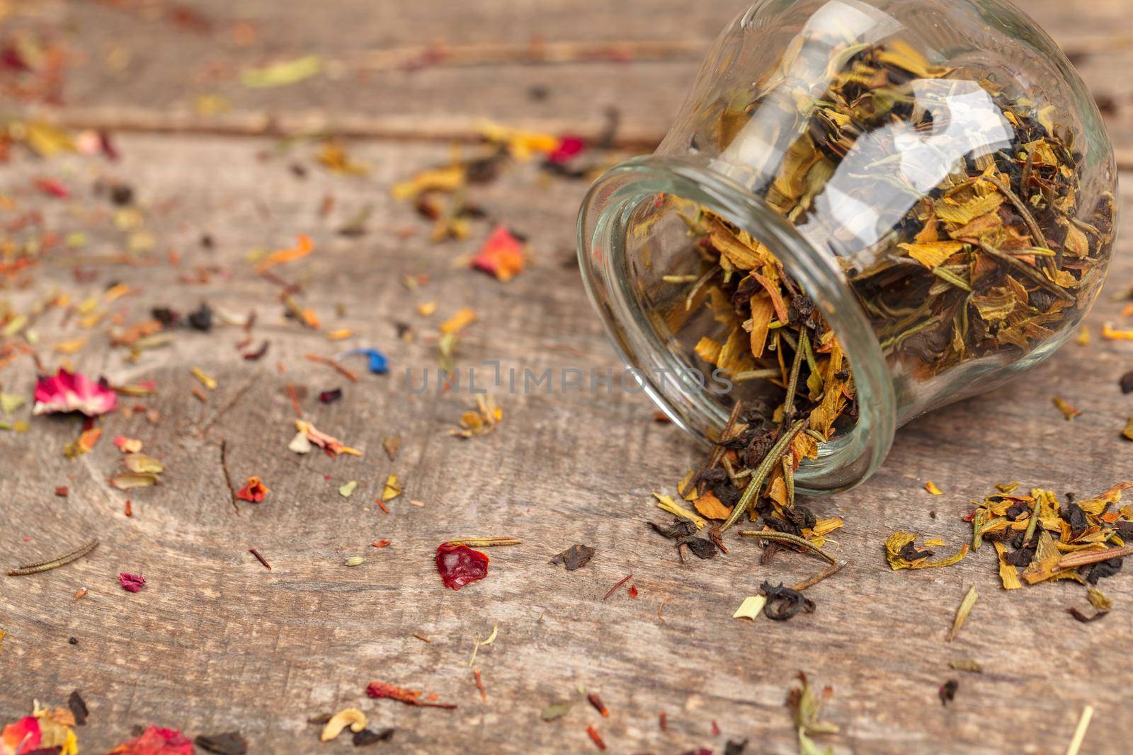 Handful of natural tea on a wodden surface