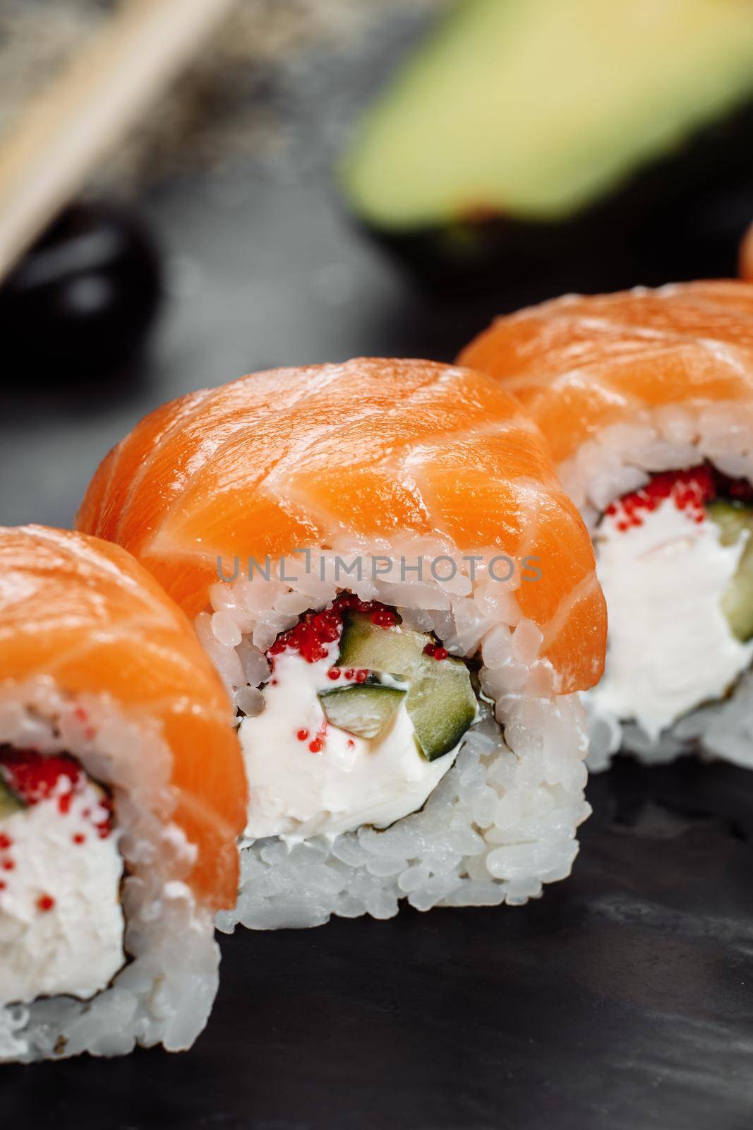 Sushi Philadelphia on a stone decorative plate.