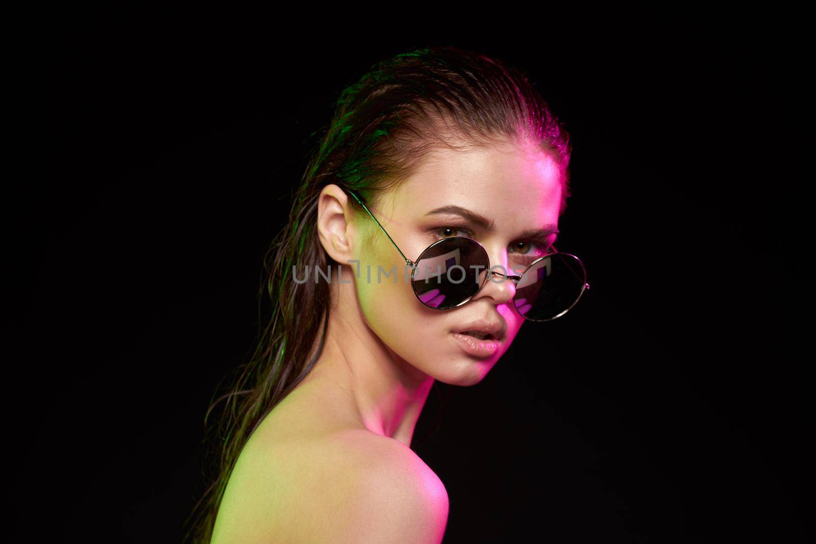 sexy woman emotions gesture hands bare shoulders dark background. High quality photo
