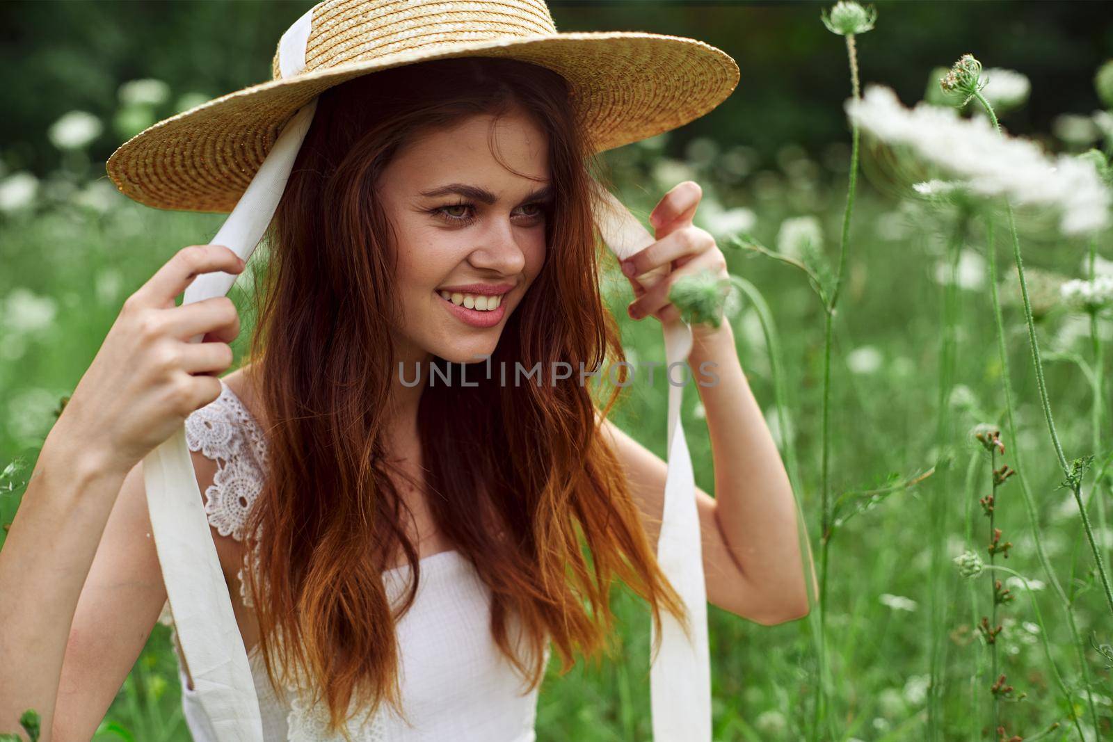 Cheerful woman nature flowers posing freedom fashion. High quality photo