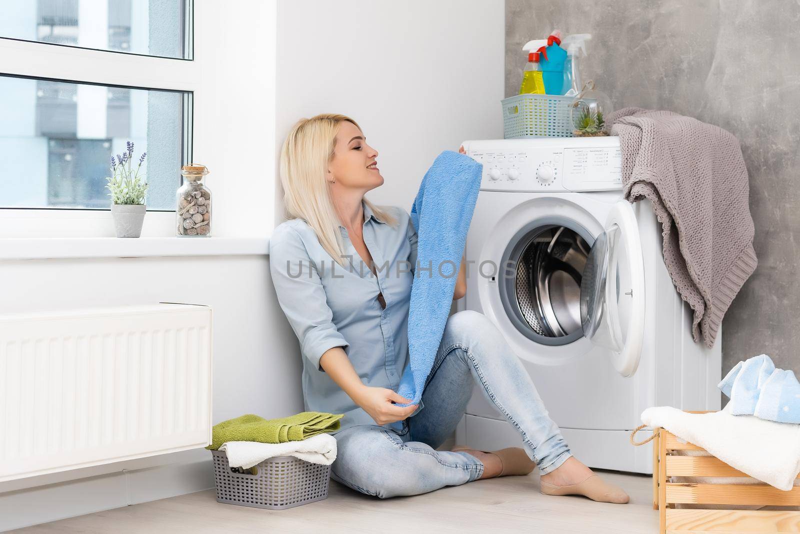 pretty smiling girl in the laundry room