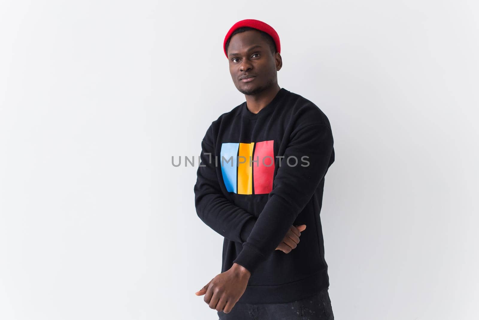 Young handsome african american man with an afro hairstyle. Portrait on white background. Guy looking at camera