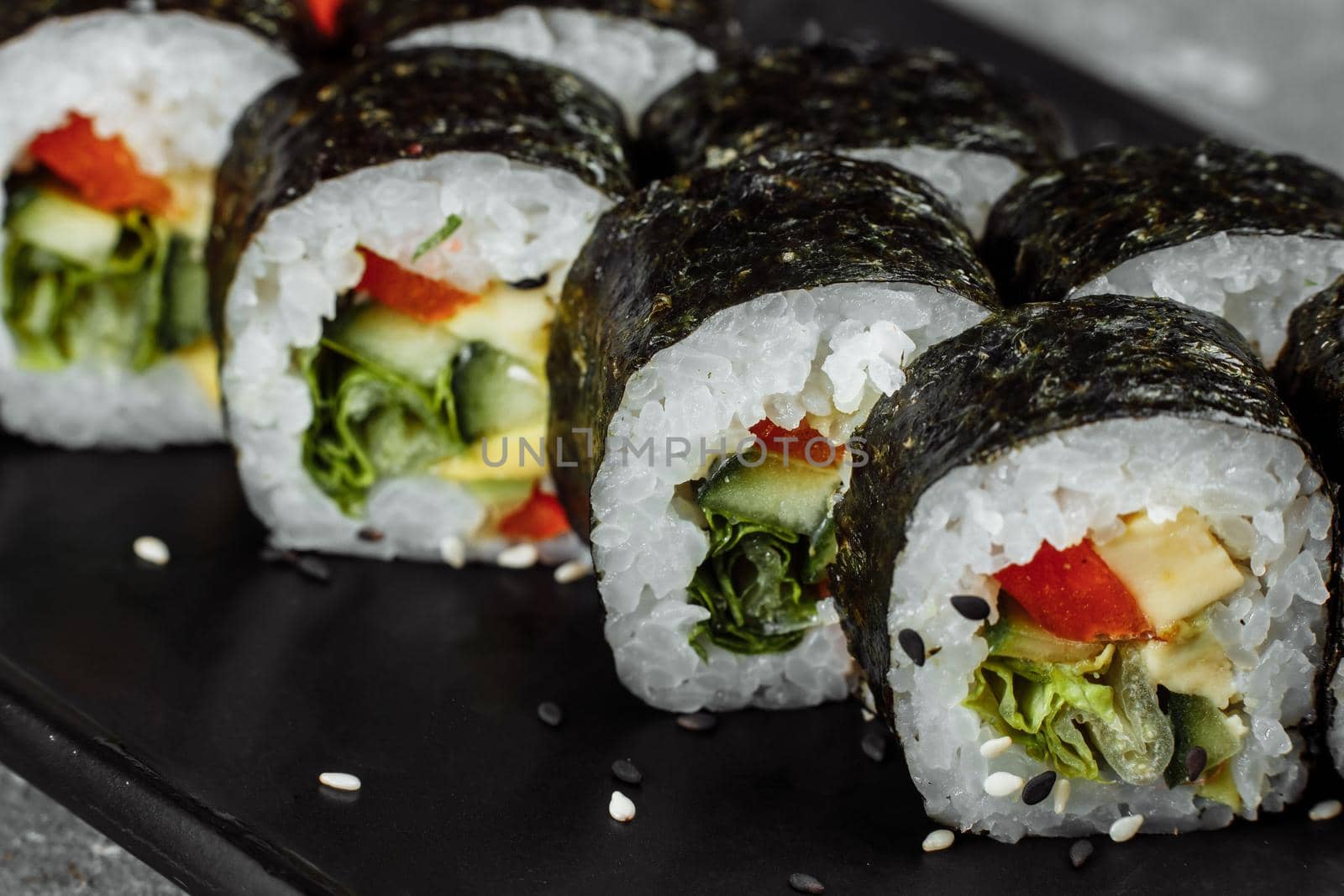 Vegetarian Maki Sushi - Roll made of Tomato, Cucumber, Bell Pepper, Salad Leaf and Japanese Mayonnaise.