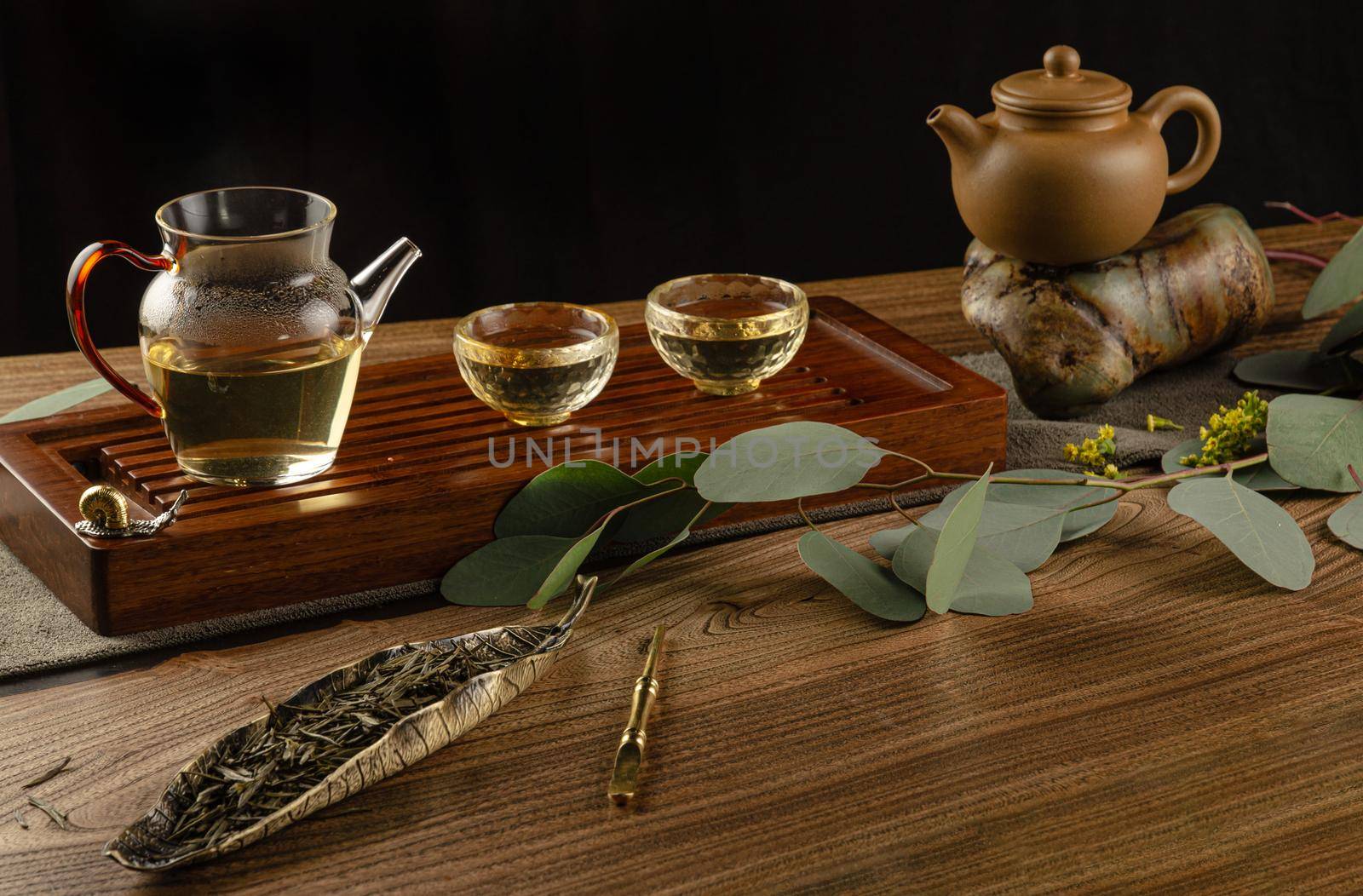 tea table with instruments teapots cups and tea Shen Puer by Rotozey