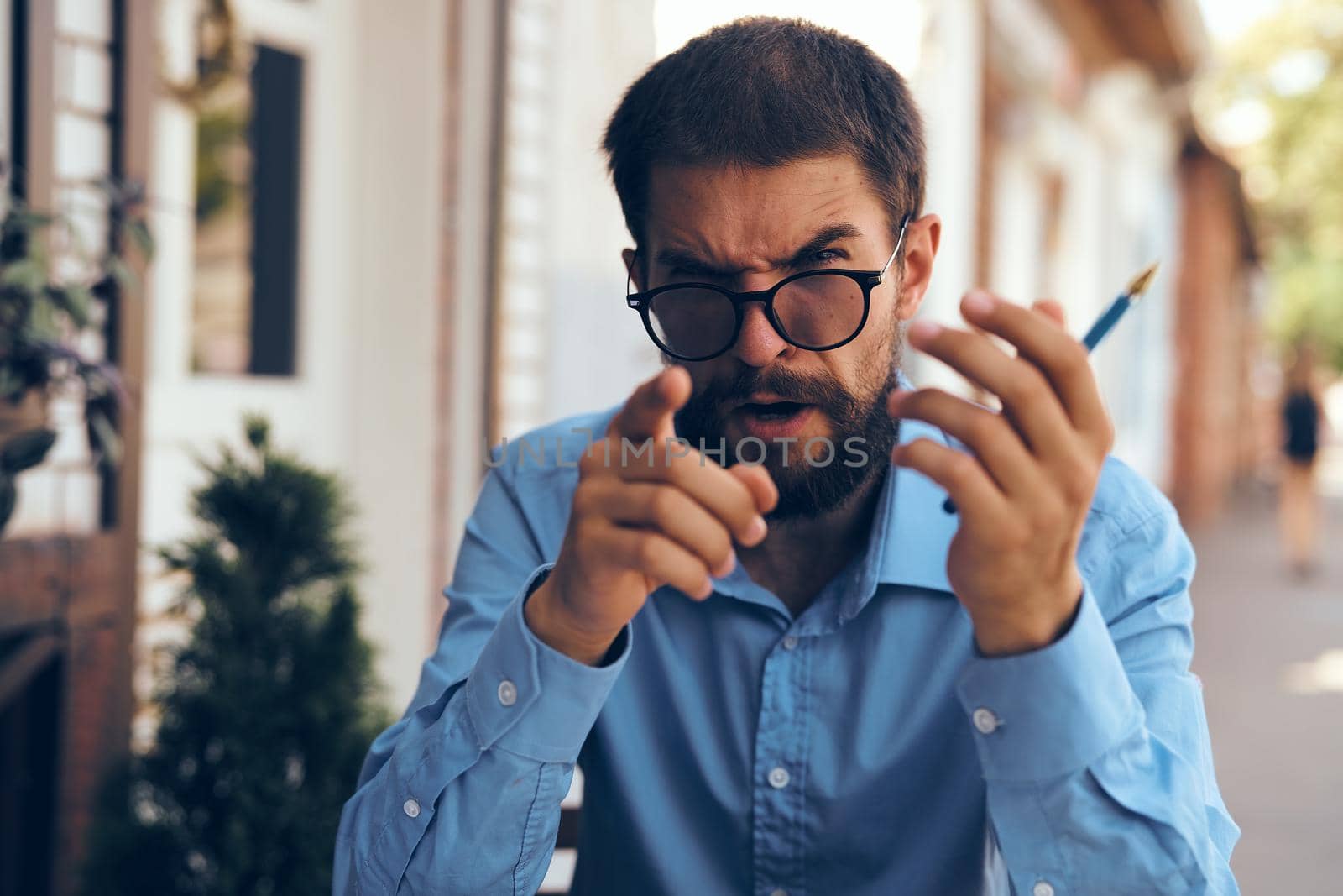 business man with papers in a summer cafe work communication. High quality photo