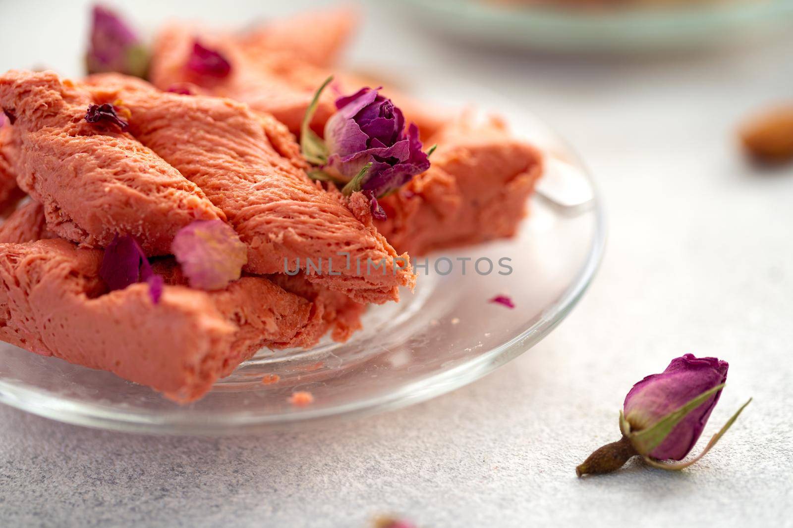 Close up photo of colorful Turkish halva sweets on gray surface