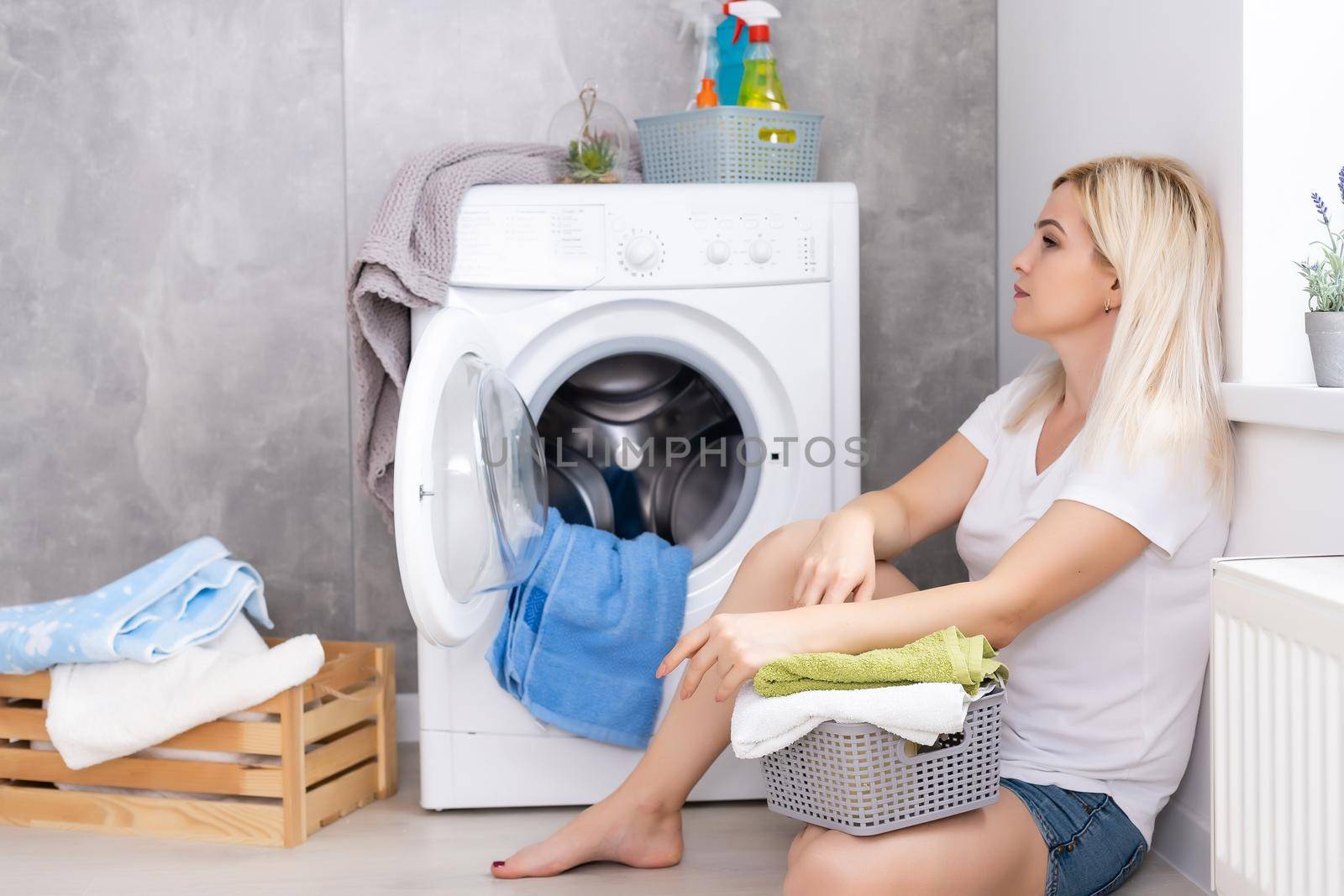pretty smiling girl in the laundry room
