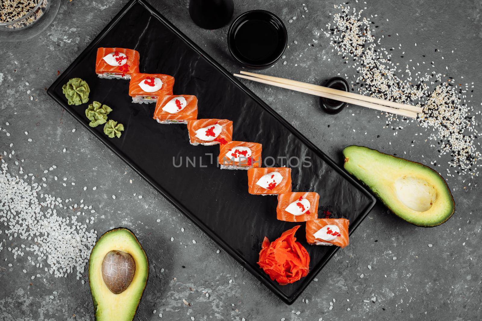 Philadelphia roll sushi with salmon, smoked eel, cucumber, avocado, cream cheese, red caviar. Sushi menu. Japanese food by UcheaD