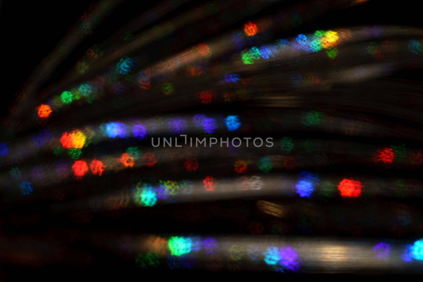 Christmas background. Festive abstract background with bokeh defocused lights and stars.