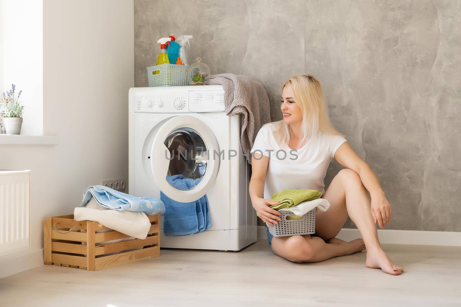 pretty smiling girl in the laundry room