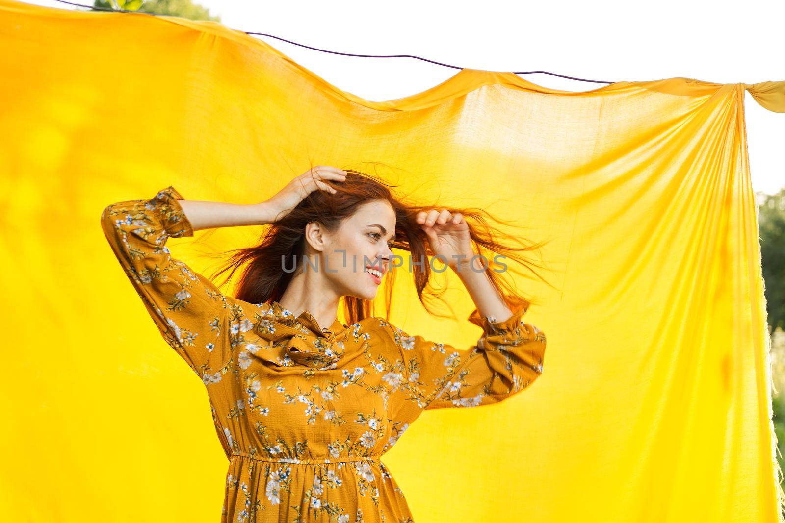 cheerful woman with hands raised up nature posing. High quality photo