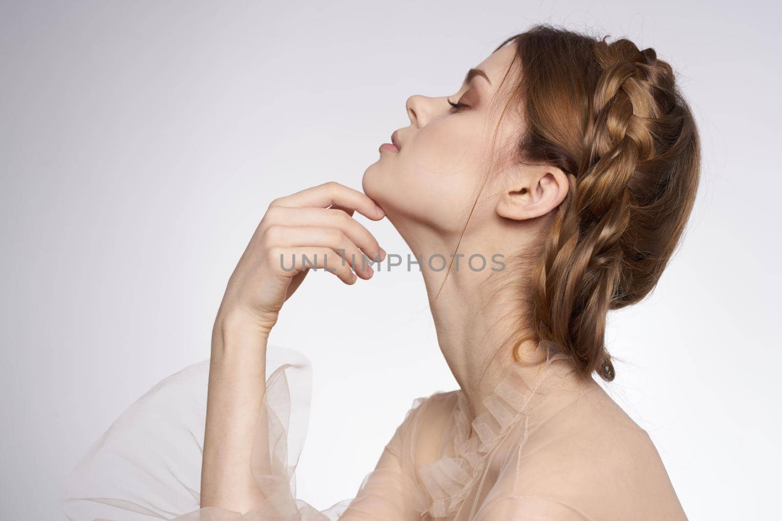 portrait of a woman hairstyle fun posing cosmetics fashion light background. High quality photo