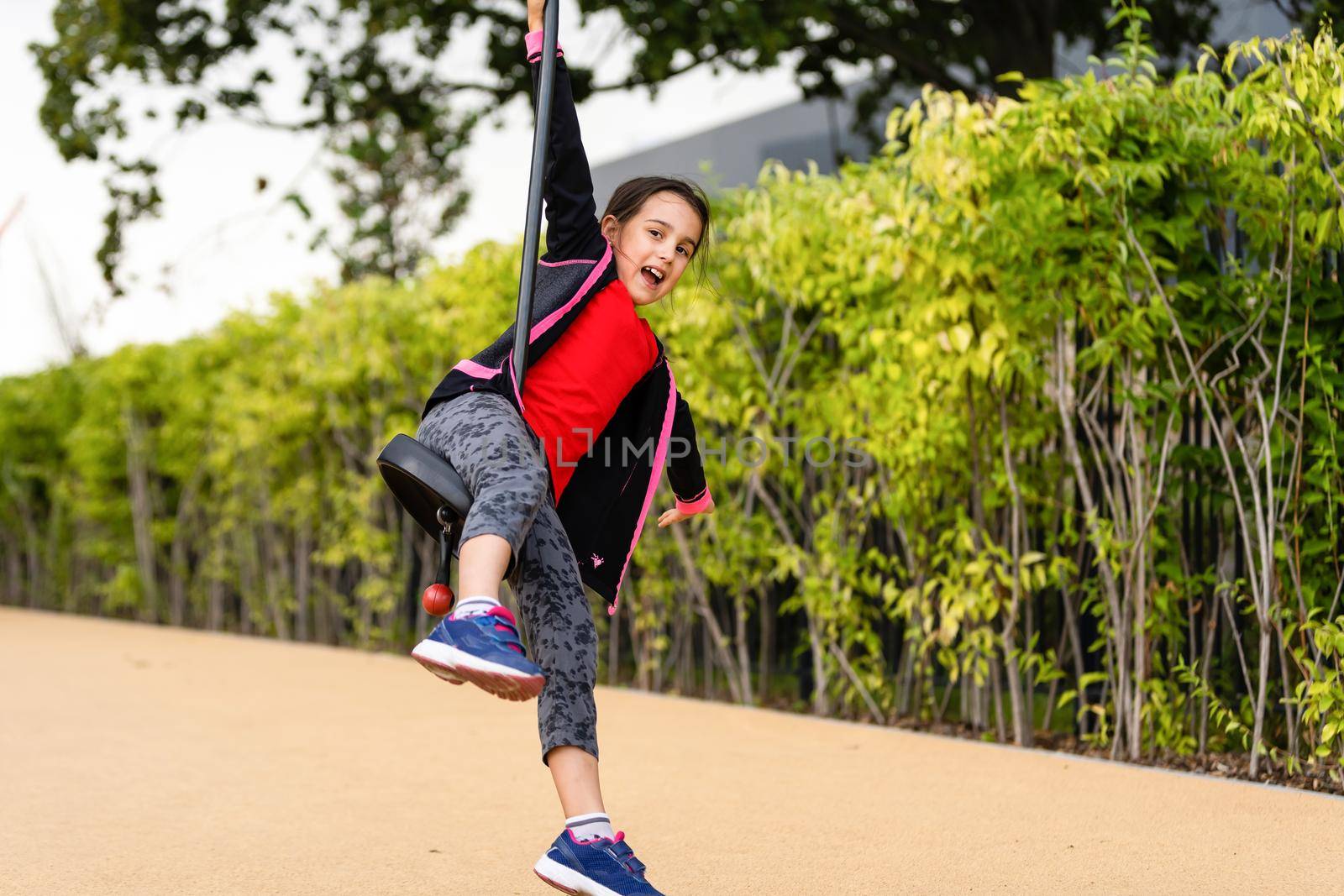 Little girl rushes on a bungee