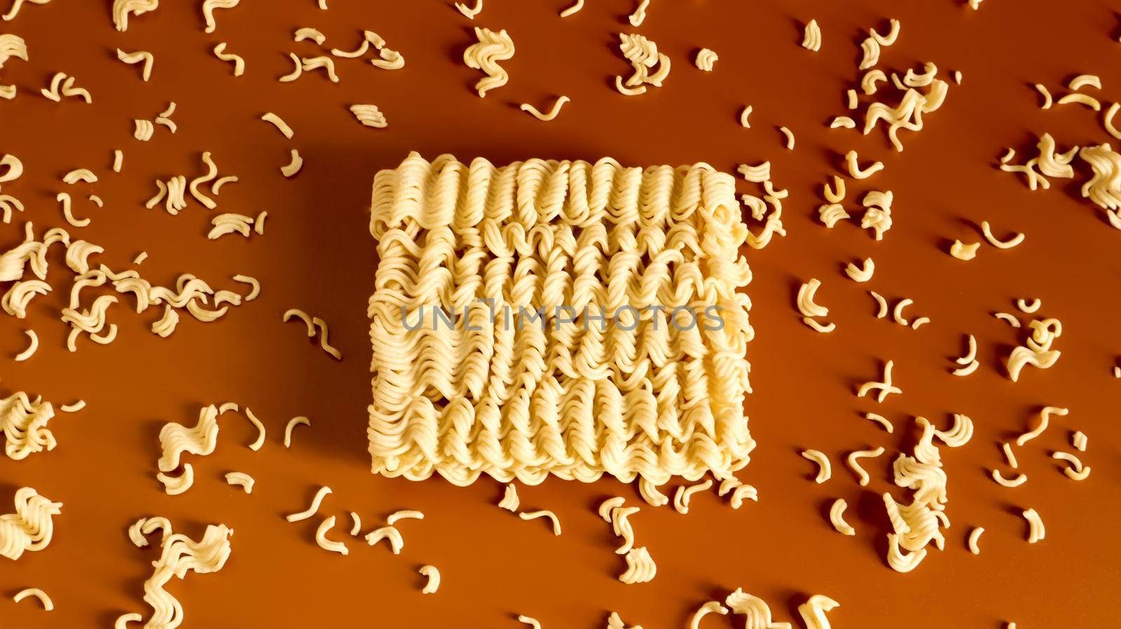 Instant noodles asian ramen. Dry yellow raw food noodles. pasta, for the preparation of which it is enough to pour boiling water and wait a few minutes. Copy space korean and japanese vermicelli