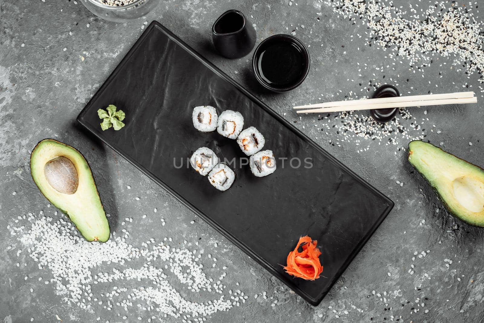 Simple maki with tuna. Sushi on a gray background.