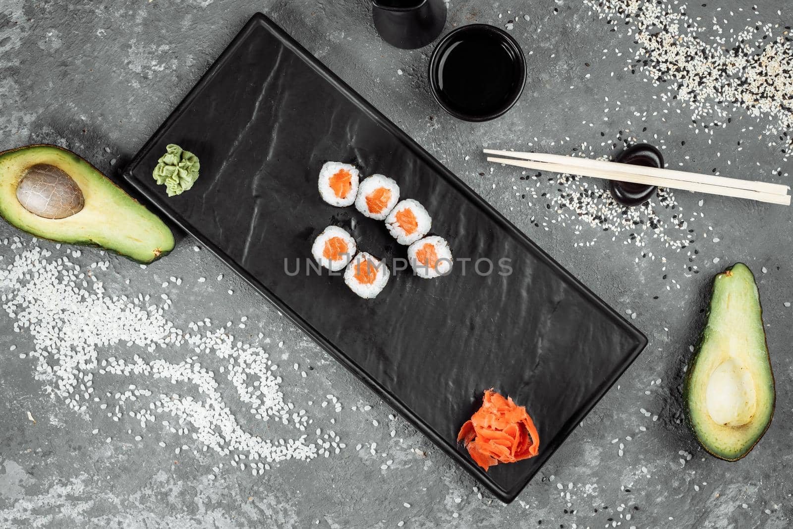 Simple maki with fresh salmon. Sushi on a gray background by UcheaD