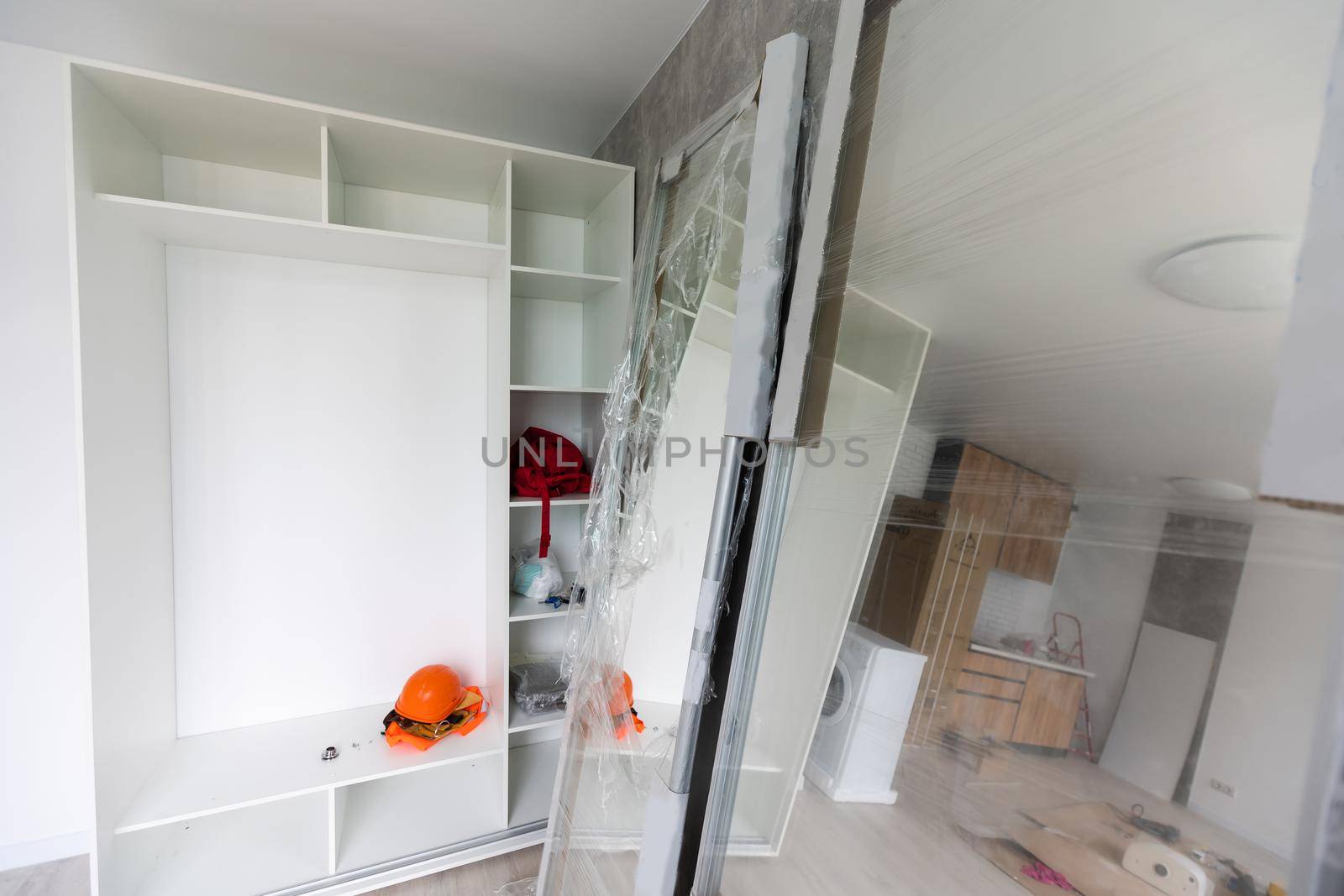 Installing new induction hob in modern kitchen kitchen Installation of kitchen cabinet.