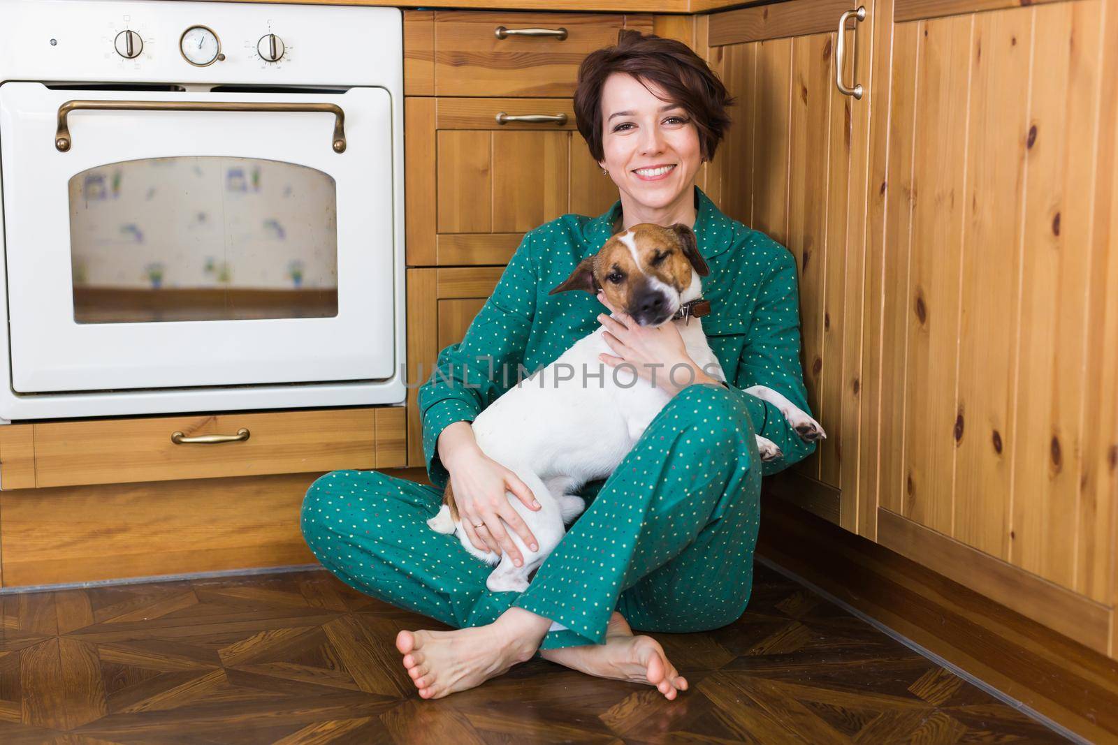 Young beautiful woman at home with her cute dog