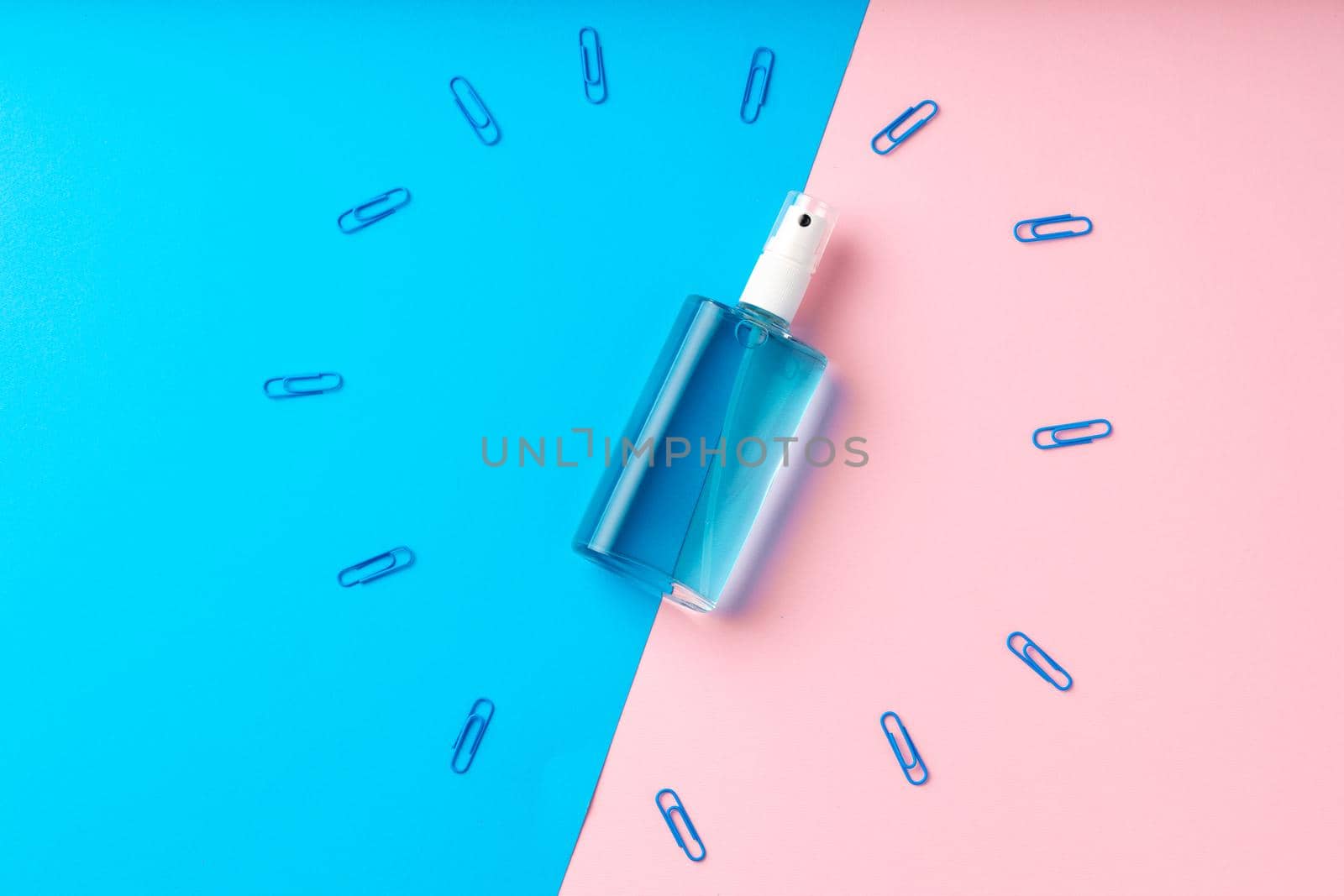 Hand sanitizer gel and school supplies top view, copy space