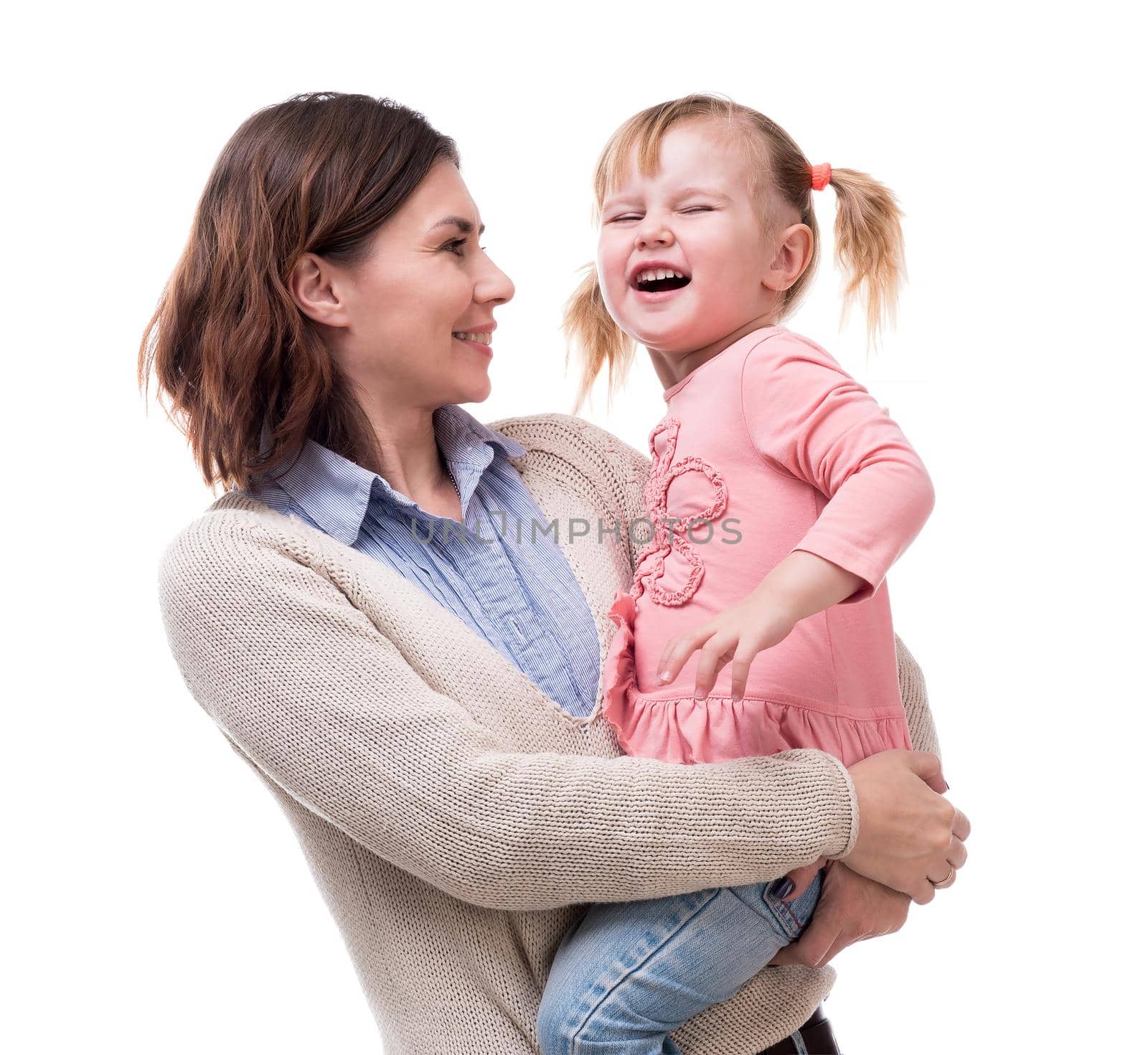 mother with little daughter in her arms hugging isolated on white background