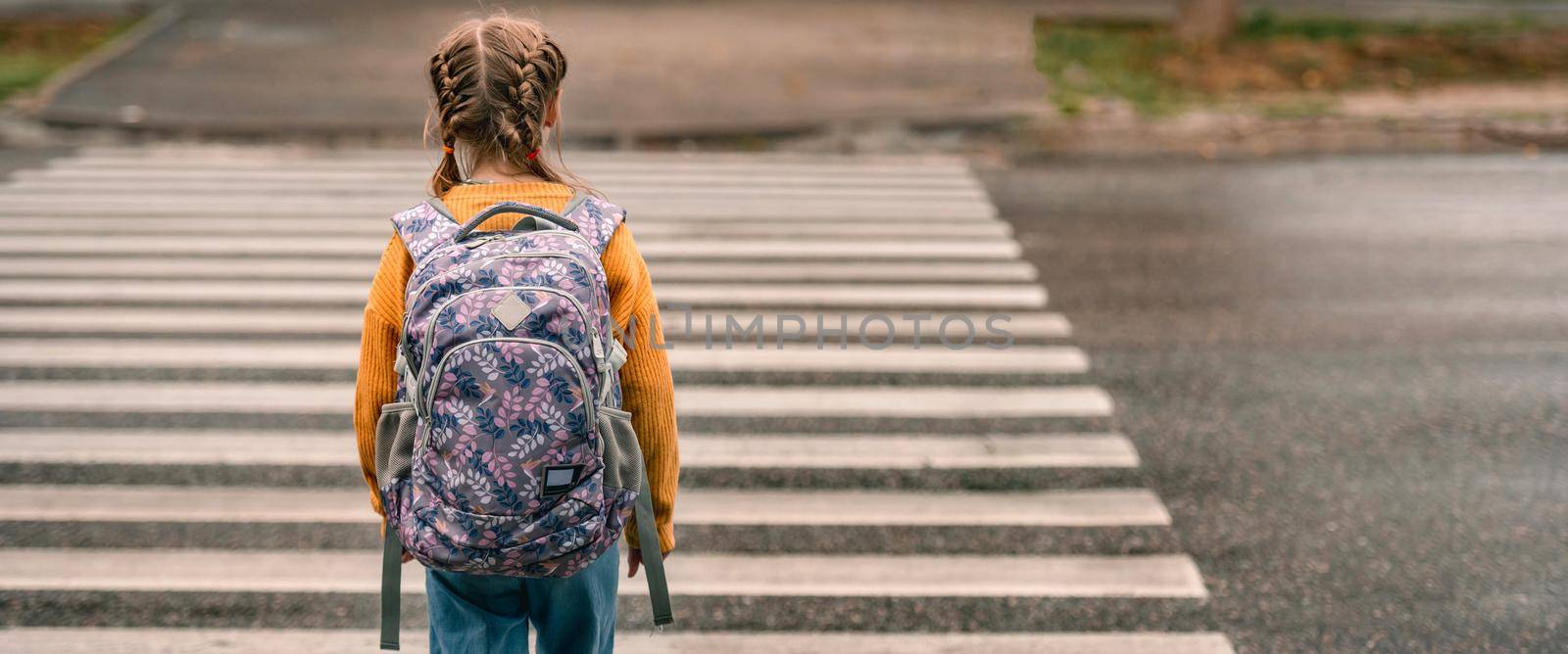 Schoolgirl with backpack outdoors by tan4ikk1