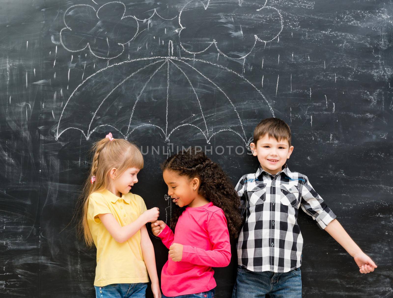 three funny children with umbrella drawn on the blackboard by GekaSkr