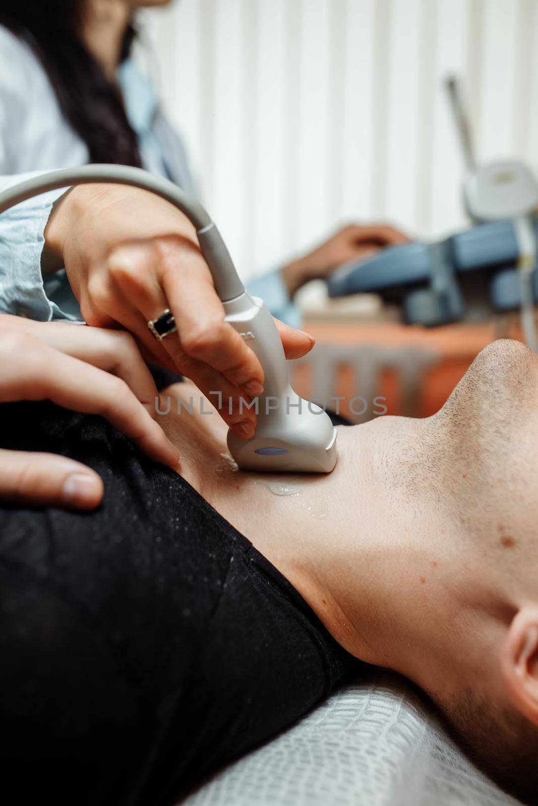 the nurse will perform an ultrasound scan on the patient neck in the office by UcheaD