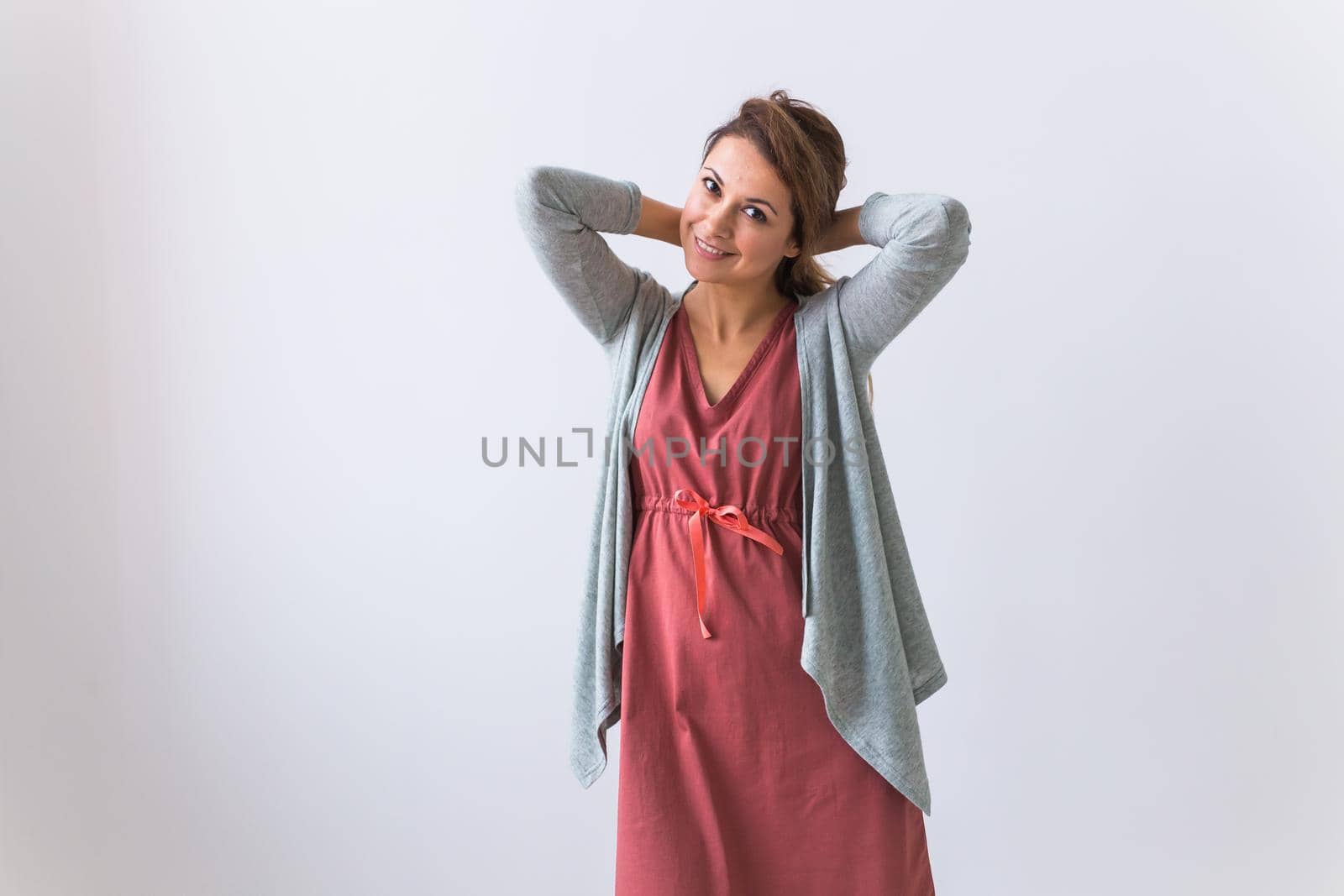 Portrait of a pretty smiling woman posing isolated on a white background