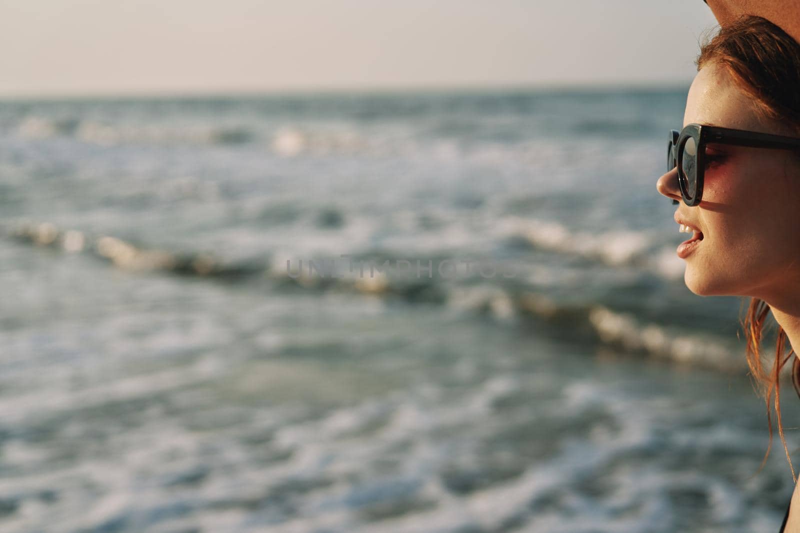 woman walking on the beach hat travel vacation sun. High quality photo