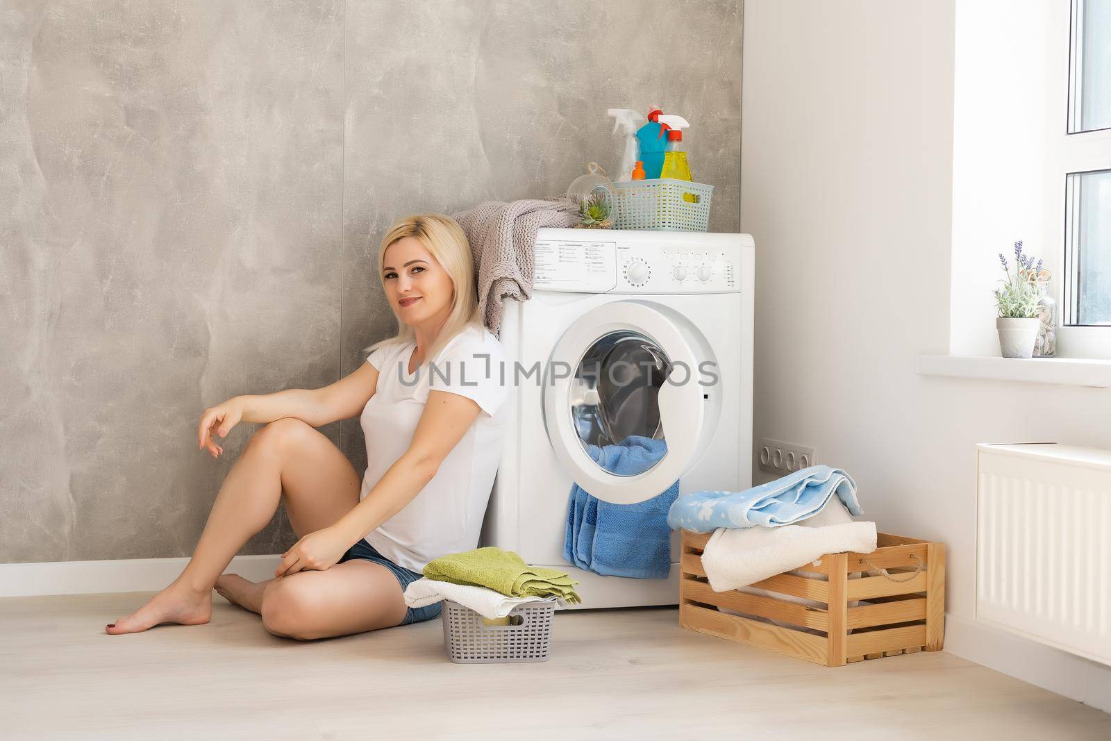 pretty smiling girl in the laundry room