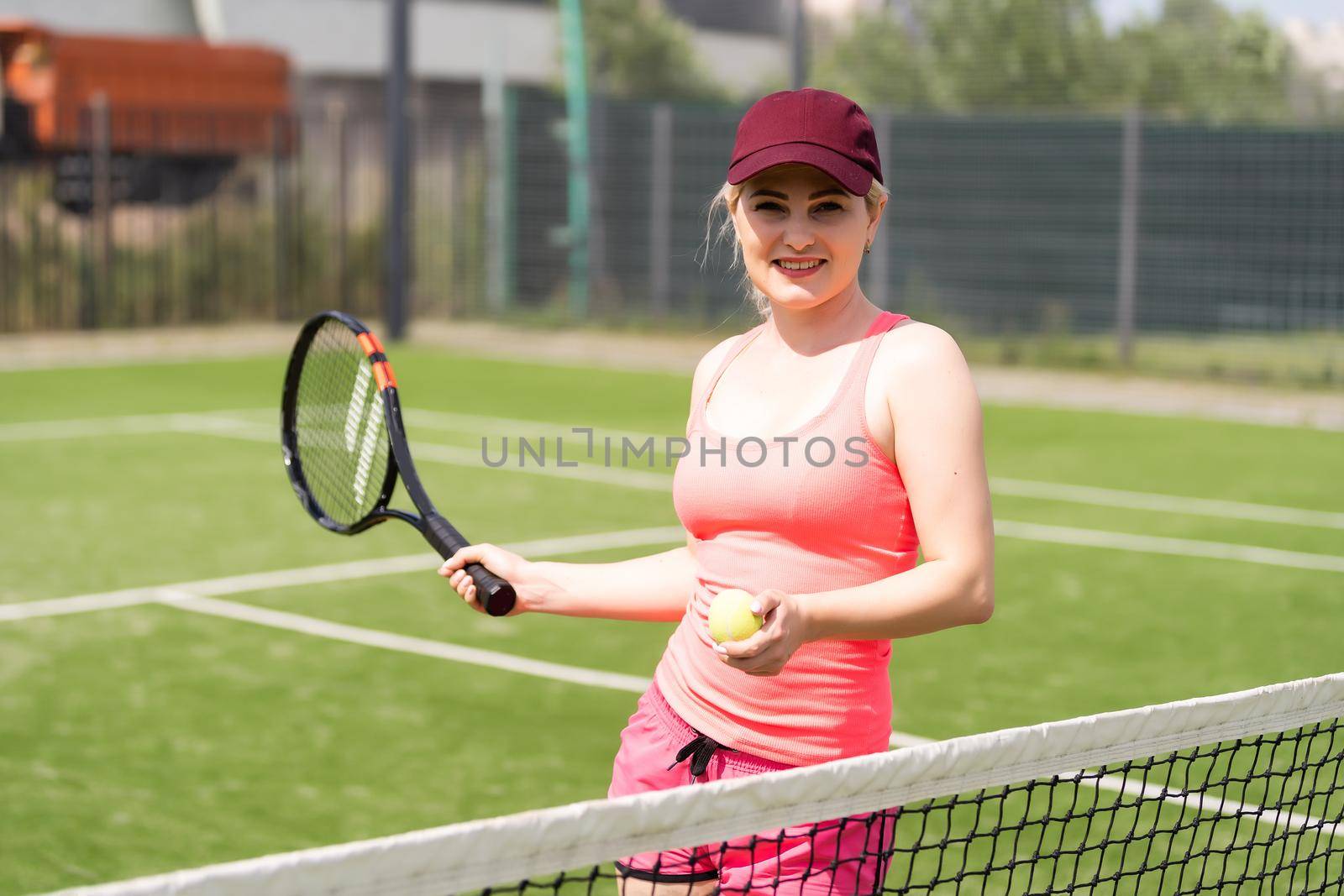 Woman playing tennis and waiting for the service