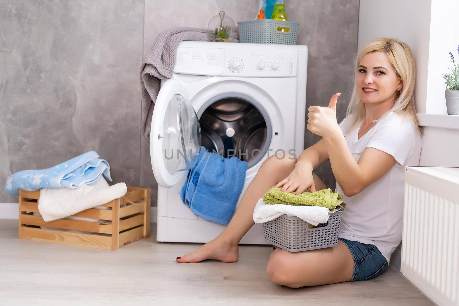 pretty smiling girl in the laundry room