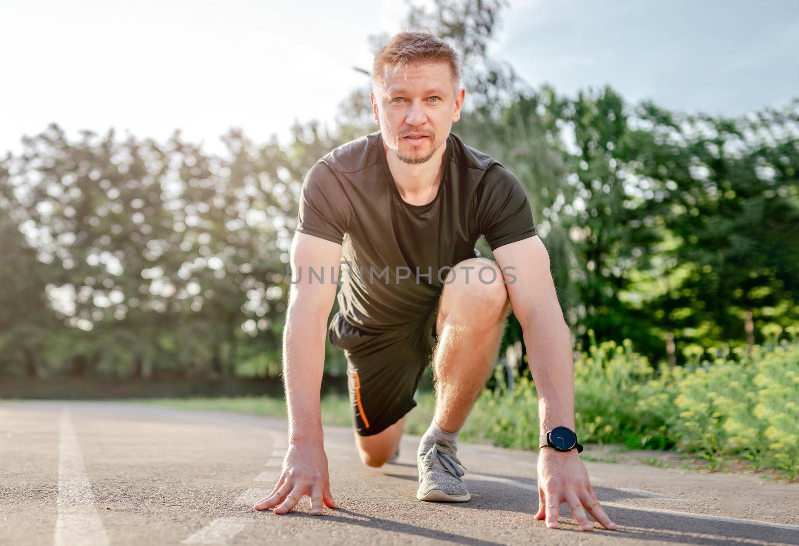 Man doing workout outdoors by tan4ikk1