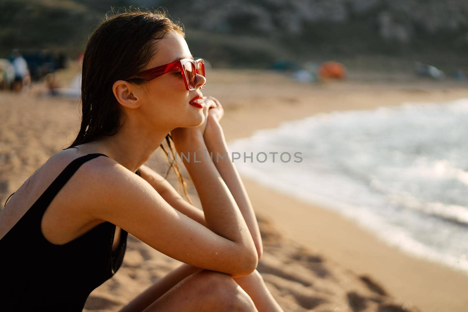 woman in a black swimsuit on the beach sea Summer vacation by Vichizh