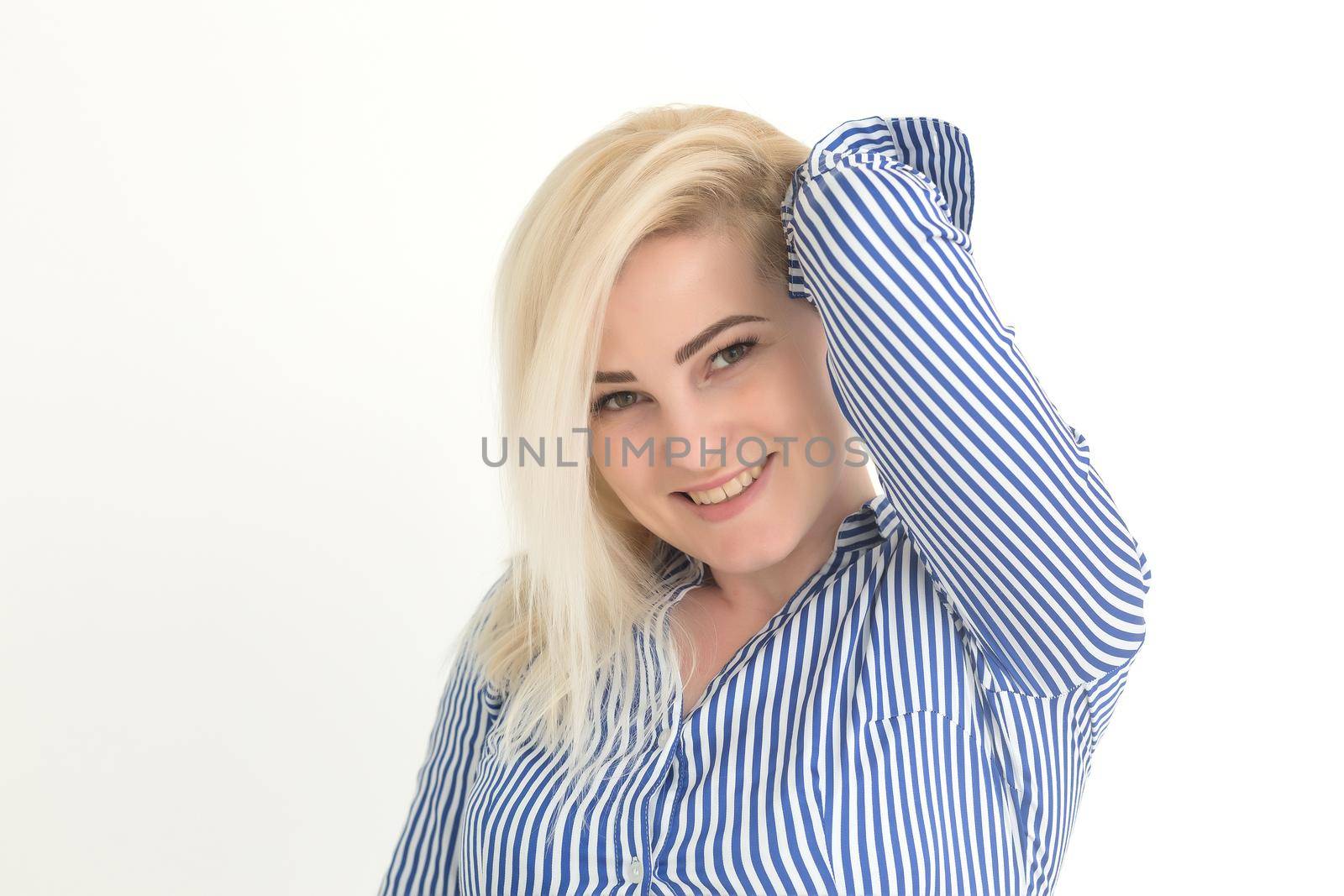 Portrait of emotive good-looking caucasian woman laughing while looking aside and standing against white background.
