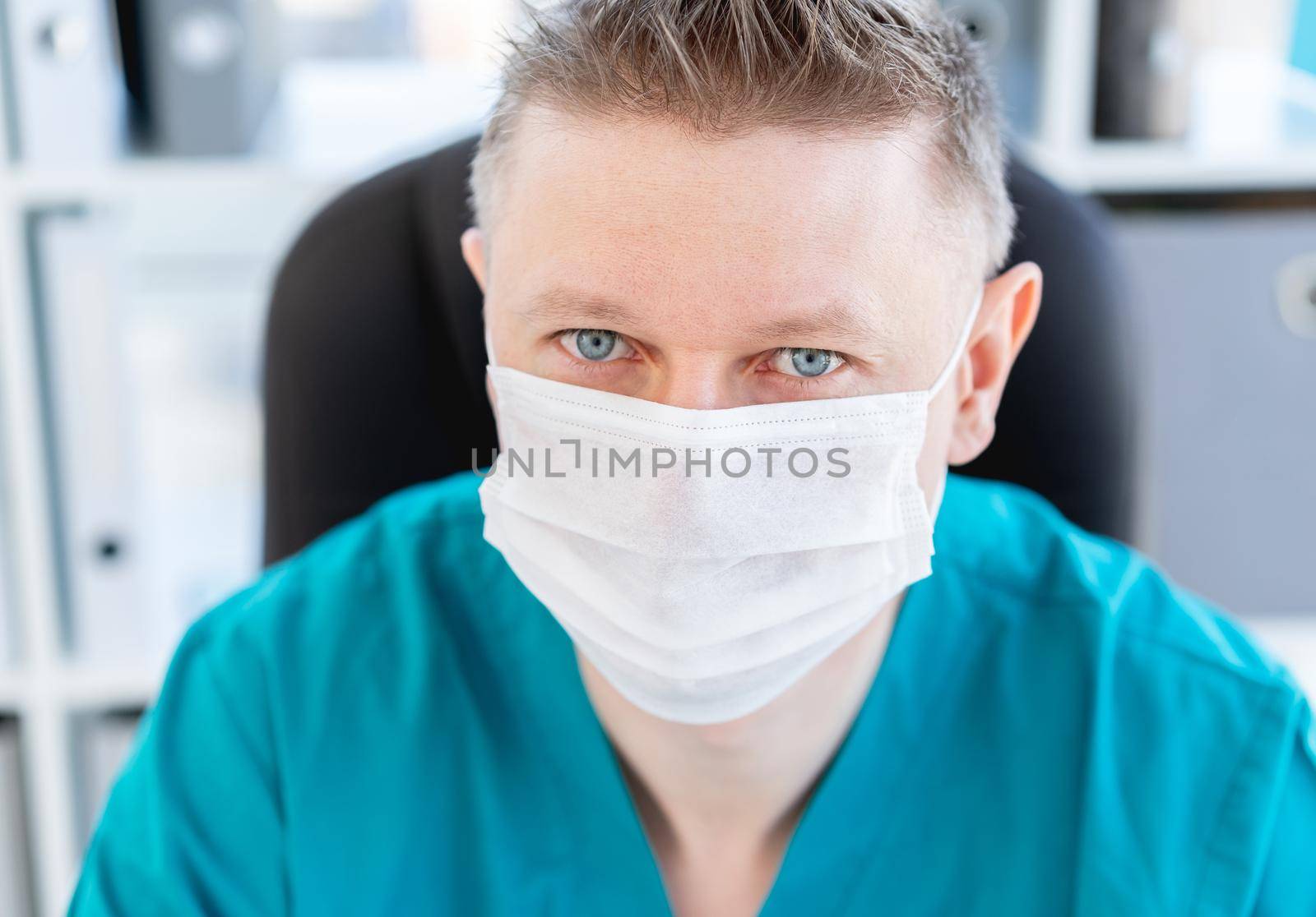 Portrait of attractive doctor in uniform at clinic