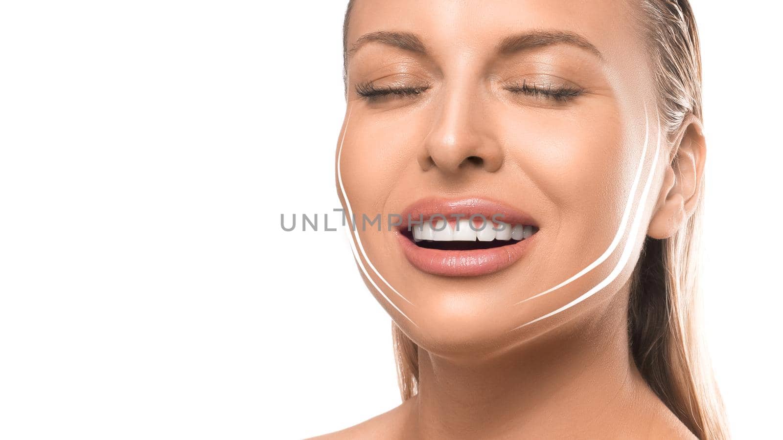 Portrait of a smiling woman with face-lifting lines on the face. Photo on white background. Face lifting concept.