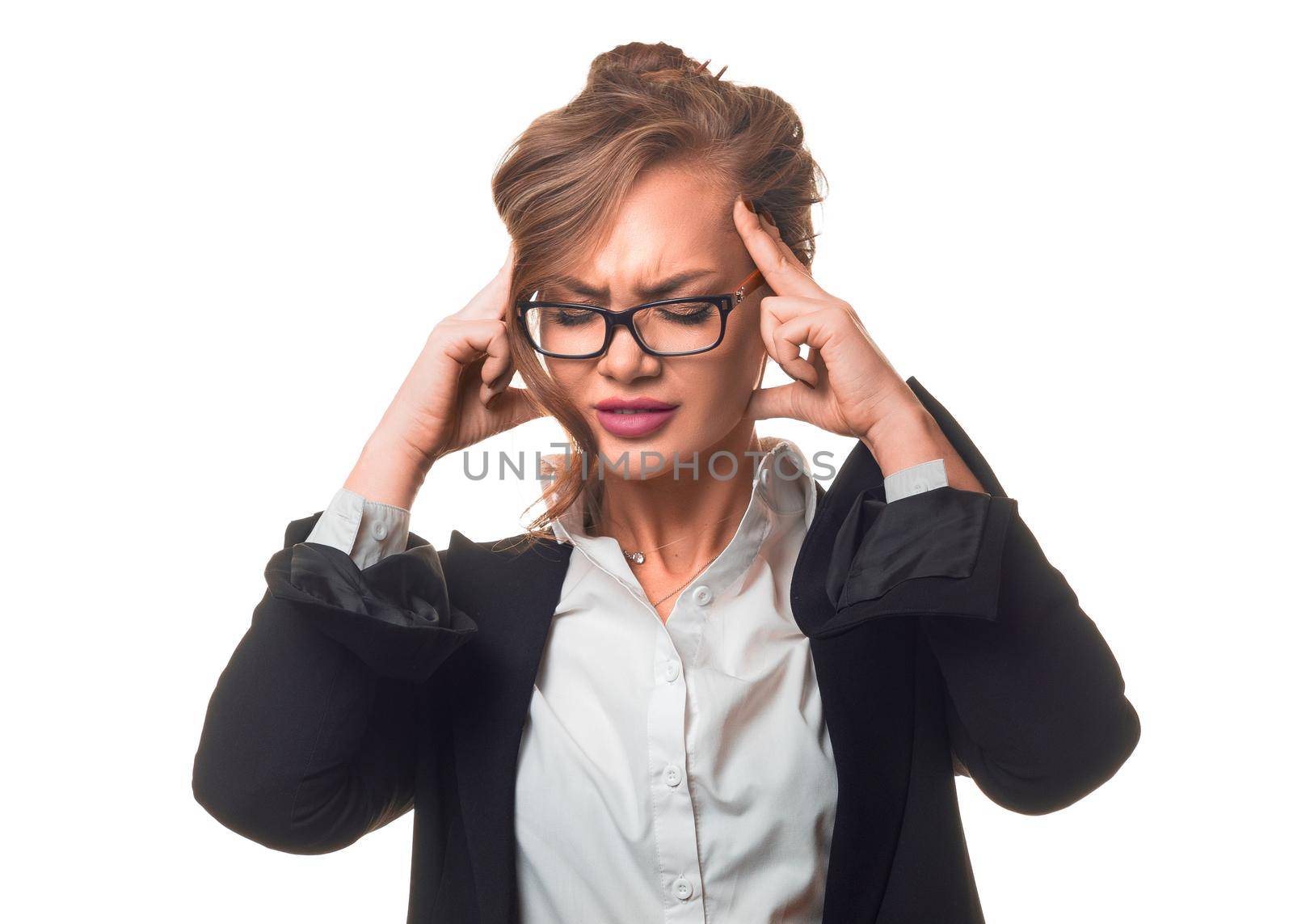 A woman massages the bridge of her nose due to eye fatigue and overwork. Serious business woman is tired. Isolated over white background.