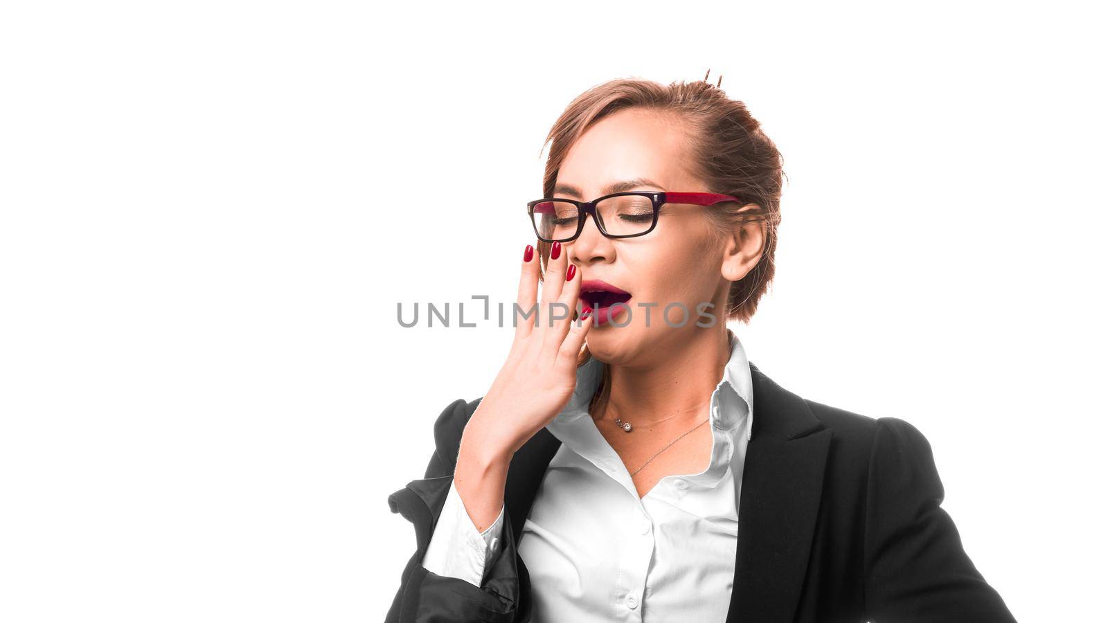 Business woman yawns. Isolated on a white background by Stavros