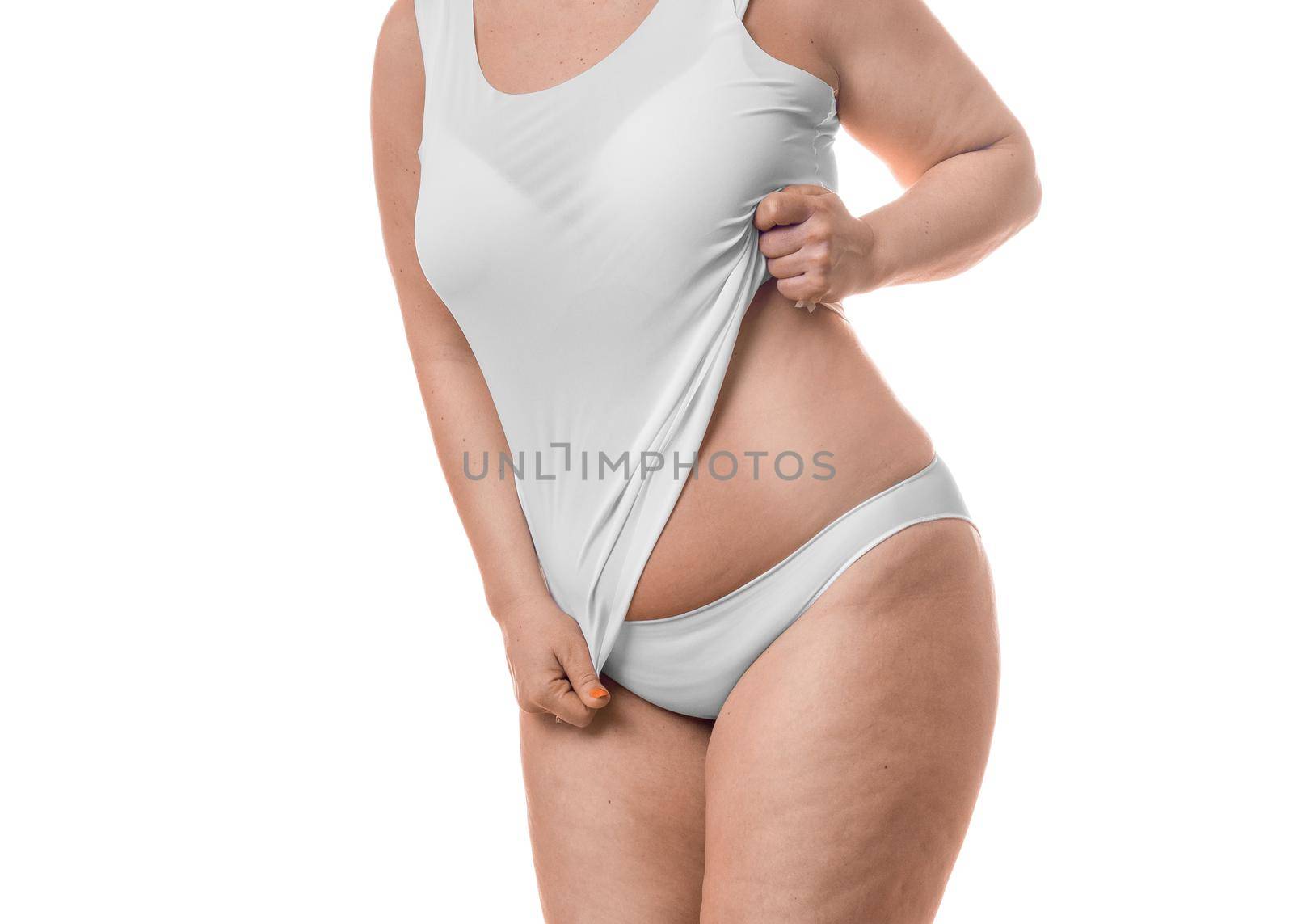 Close up photo of a fat woman showing her waist - isolated over white background. Slimming concept.