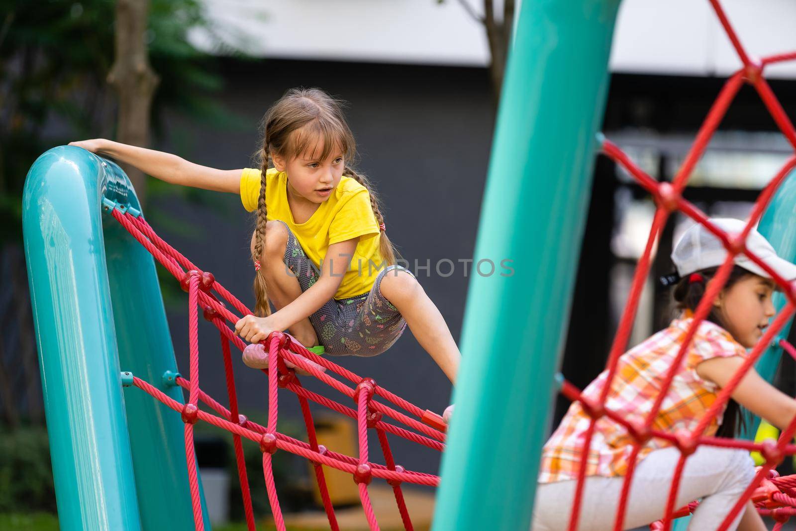 happy excited kids having fun together on playground by Andelov13