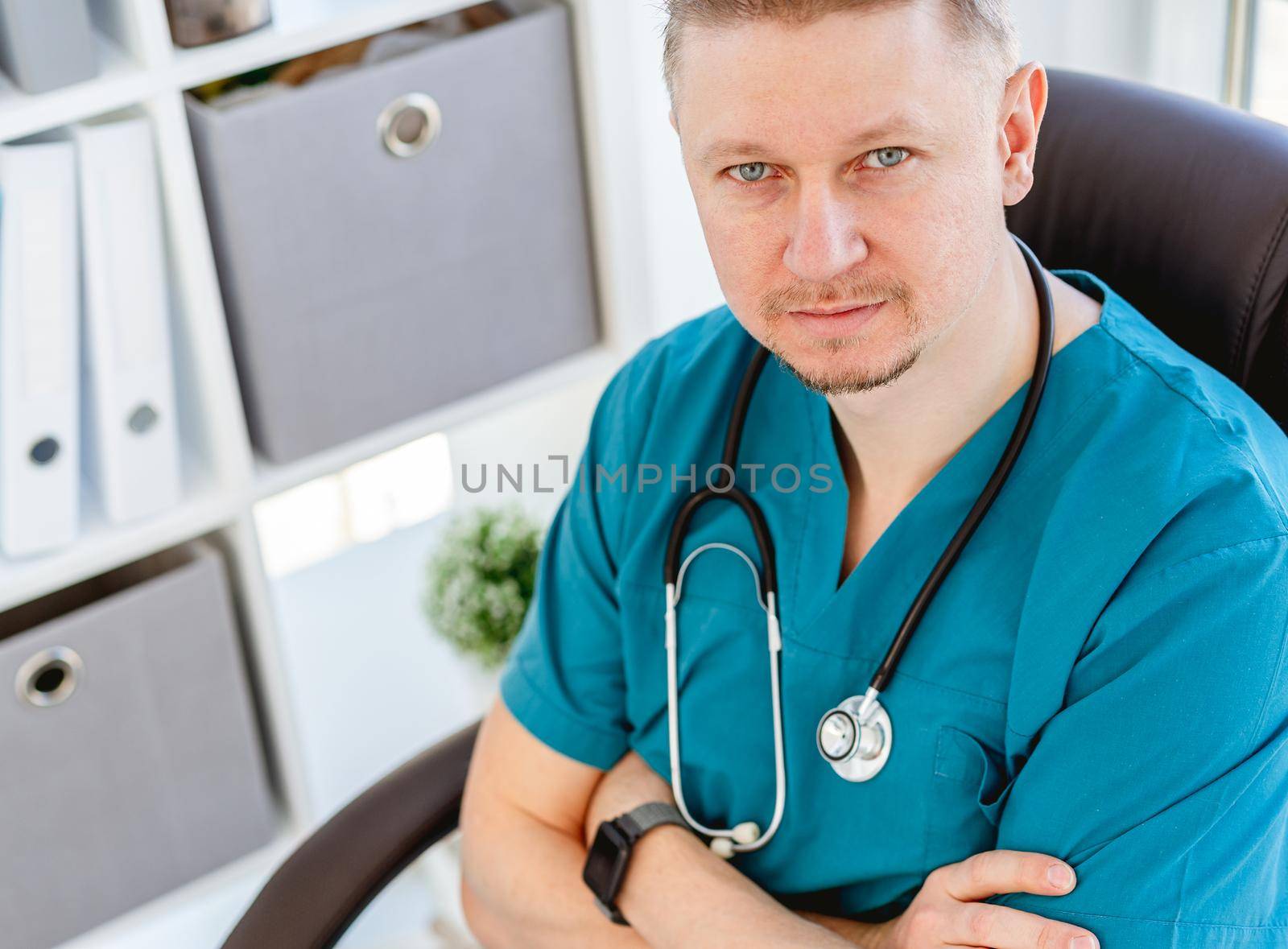 Portrait of attractive doctor in uniform at clinic