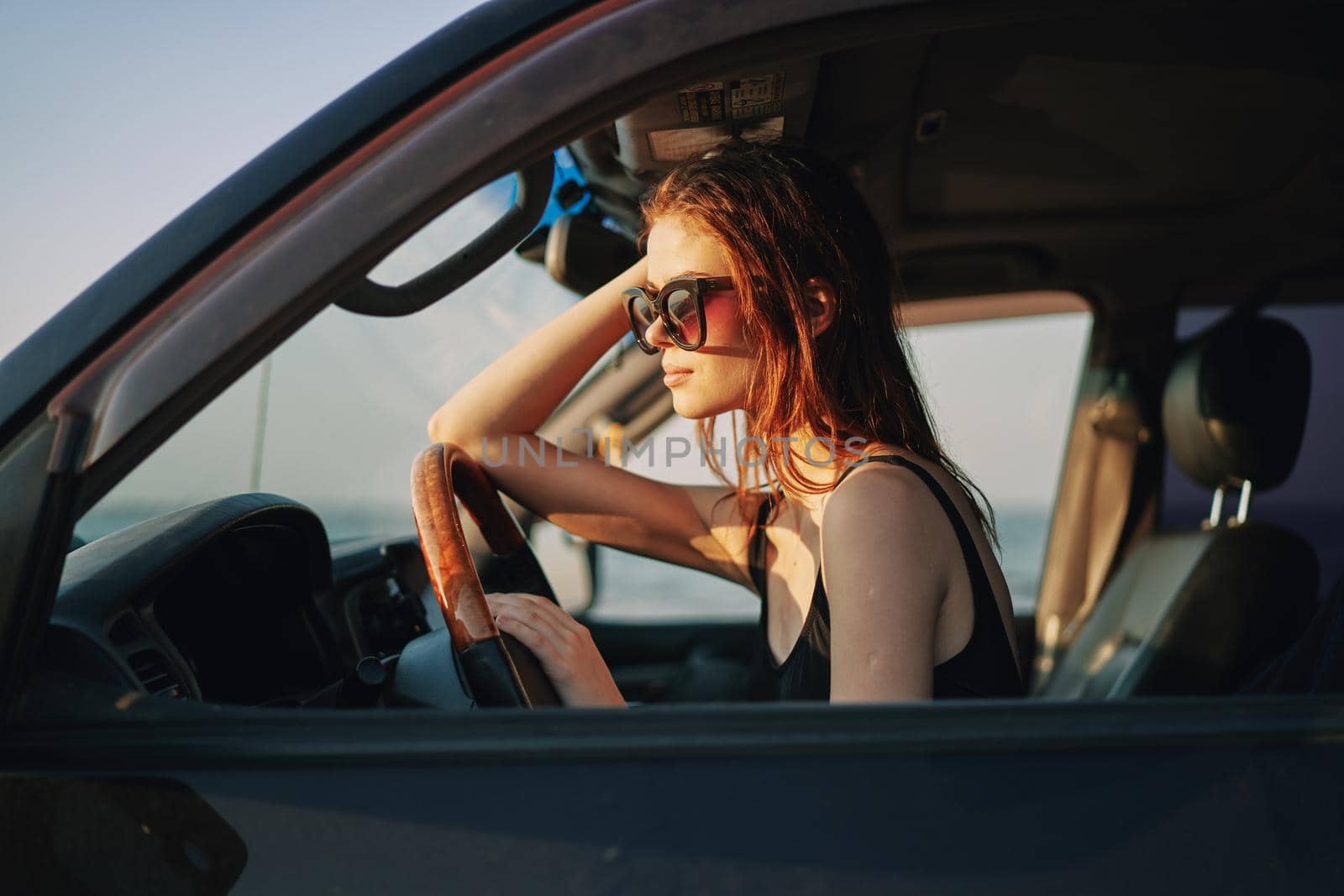 woman driving in car trip posing fashion travel. High quality photo