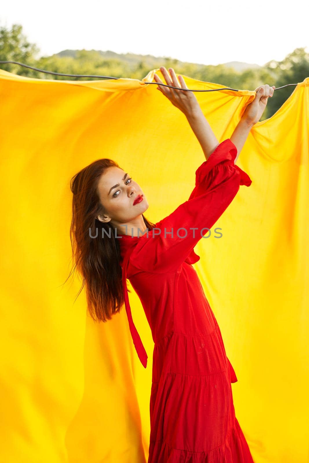 pretty woman nature yellow cloth fresh air glamor. High quality photo