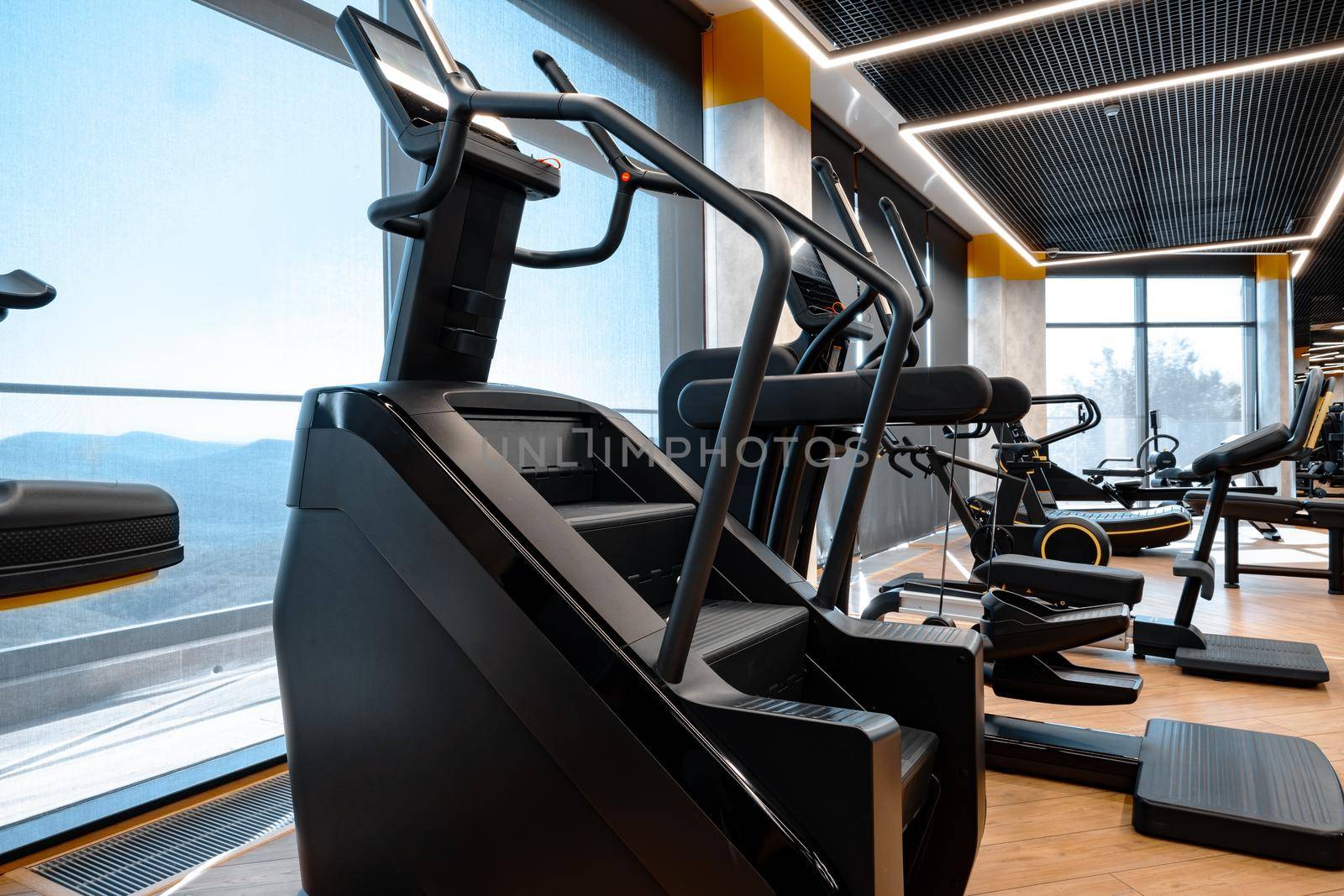 Modern gym interior with new fitness equipment, no people